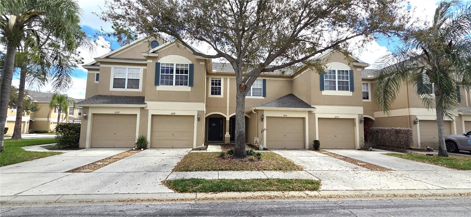 Welcome to this 3-bedroom, 2.5-bath townhome located in the desirable gated community of Vista Cay. Offering 1,718 square feet of living space and a 1-car attached garage, this home features a spacious and functional layout perfect for everyday living and entertaining.

The main level boasts a generous kitchen that flows seamlessly into the combined living and dining area, along with a convenient half bath for guests. The living room opens to a covered, screened lanai—ideal for relaxing outdoors. Tile flooring runs throughout the first floor, while all bedrooms upstairs are comfortably carpeted.

Upstairs, you’ll find all three bedrooms, including a primary suite with an en-suite bathroom featuring dual sinks and a tub/shower combination. Two additional bedrooms share a full bath, and the upstairs laundry closet comes complete with a washer and dryer for added convenience.

Enjoy easy access to the community pool, located just steps from your back door. This home offers comfort, convenience, and a prime location within Vista Cay—perfect as a primary residence, vacation home, or possible investment opportunity.