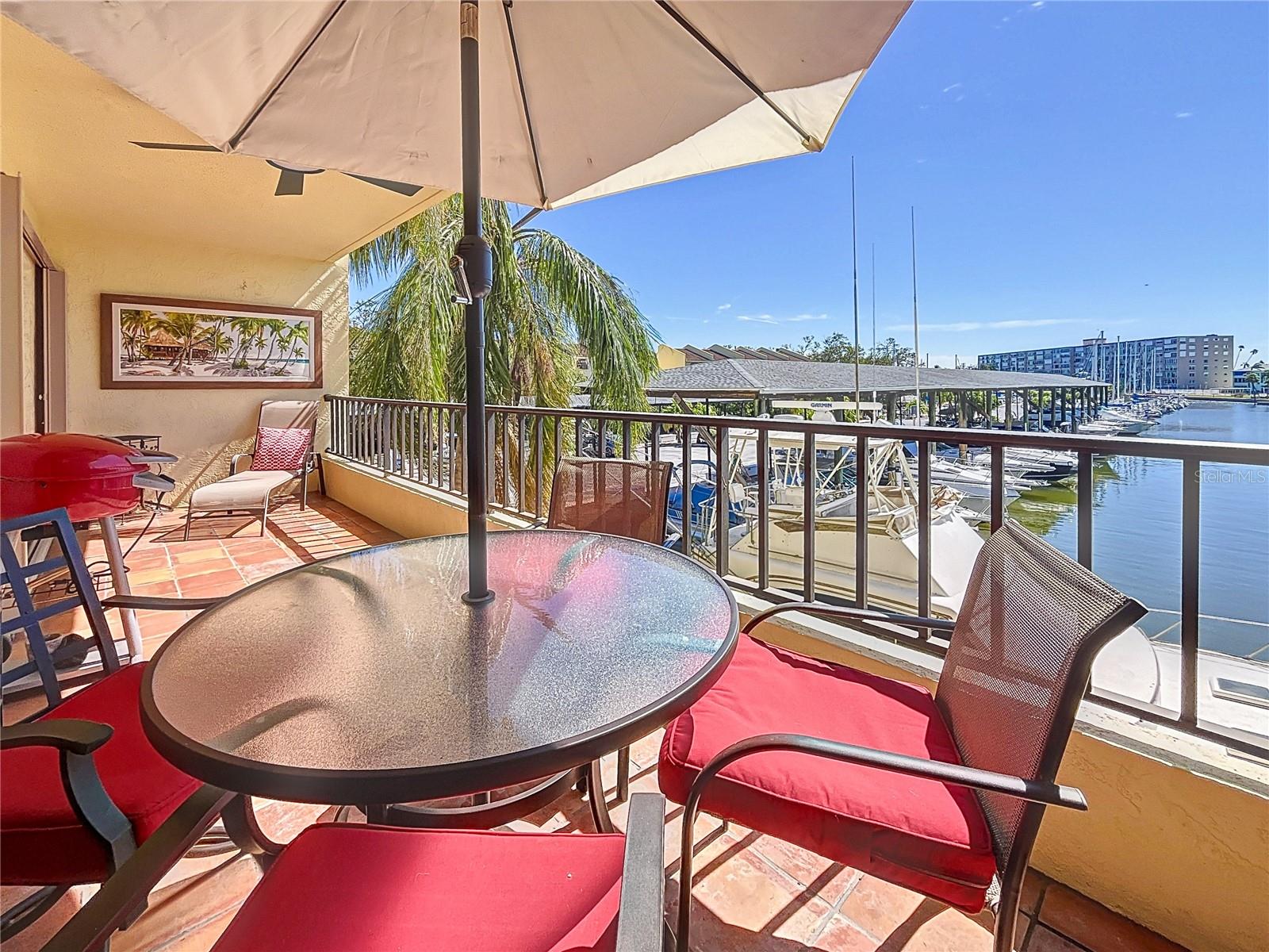 FULLY FURNISHED with EXCEPTIONAL WATERFRONT VIEWS - DISCOVER YOUR OWN SLICE OF PARADISE!  Don't miss the chance to own this impeccably maintained 1 bedroom, 1.5 bath upgraded ALL AGES, PET FRIENDLY condominium.  The living area boasts an inviting open floor plan leading to a oversized balcony.  The kitchen has been modernized with new Shaker cabinets, appliances, quartz counters, pantry, and a breakfast bar.  Unwind in the living and dining space while relishing the breathtaking views this unit offers.  The bedroom, complete with a huge walk-in closet and remodeled ensuite bath, offers comfort and elegance. Both bathrooms have undergone stylish updates.  The unit features a full-size washer and dryer, along with a tankless water heater. Entertain on your spacious balcony, perfect for hosting guests who will marvel at the captivating water views.  A covered parking space is included with this unit, and most furnishings will convey with the condo. The complex is conveniently located for a short bike ride to the beach, local restaurants, and offers easy access to downtown St. Petersburg and Interstate 275 for a quick trip to Tampa. Shopping and dining of all kinds is just a stone's throw away.  This condo is designed for those who seek to love where they live and embrace the true Florida lifestyle.  The association's amenities extend to a newly updated clubhouse with a kitchen, a pool for relaxation, his and hers saunas, and a kayak storage rack with a launching area suitable for fishing or simply unwinding.  If boating is your passion, take advantage of the marina amenities next door.  Discover the perfect blend of comfort, convenience, and coastal living in this remarkable unit!  All information deemed to be accurate but is not warranted, buyer to verify.