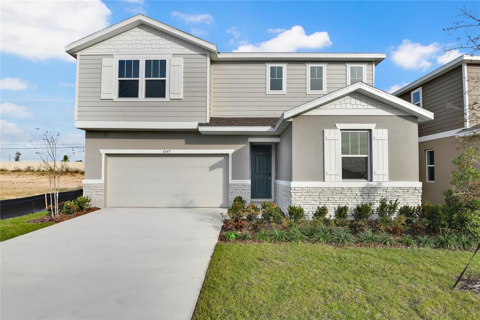 Spacious and accommodating, the two-story Moonstone features an open-concept main floor and four charming bedrooms upstairs. Just off the entryway, you'll find a secluded Bedroom with a full bath on main floor. Toward the back of the home, a large great room flows into an inviting kitchen with a center island and adjacent dining room. Kitchen is fully equipped with GE stainless steel appliances, Quartz Counter tops and White 42" cabinets. Upstairs, a loft offers a versatile common area, and a sprawling owner's suite includes an attached bath and walk-in closet. Experience Florida living at its finest with a covered lanai ideal for entertaining. A large owners bedroom with en suite bathroom boasts a tiled shower enclosure and double vanity. Also included: a spacious laundry room, versatile loft and 2-car garage. *Take advantage of special financing on quick move-in homes OR buy a to-be-built home and enjoy up to $20,000 in Flex Funds toward homes that can close in a timely manner! Options may vary by community, and offers are available on select homes on a first-come, first-served basis. Contact builder for more information!