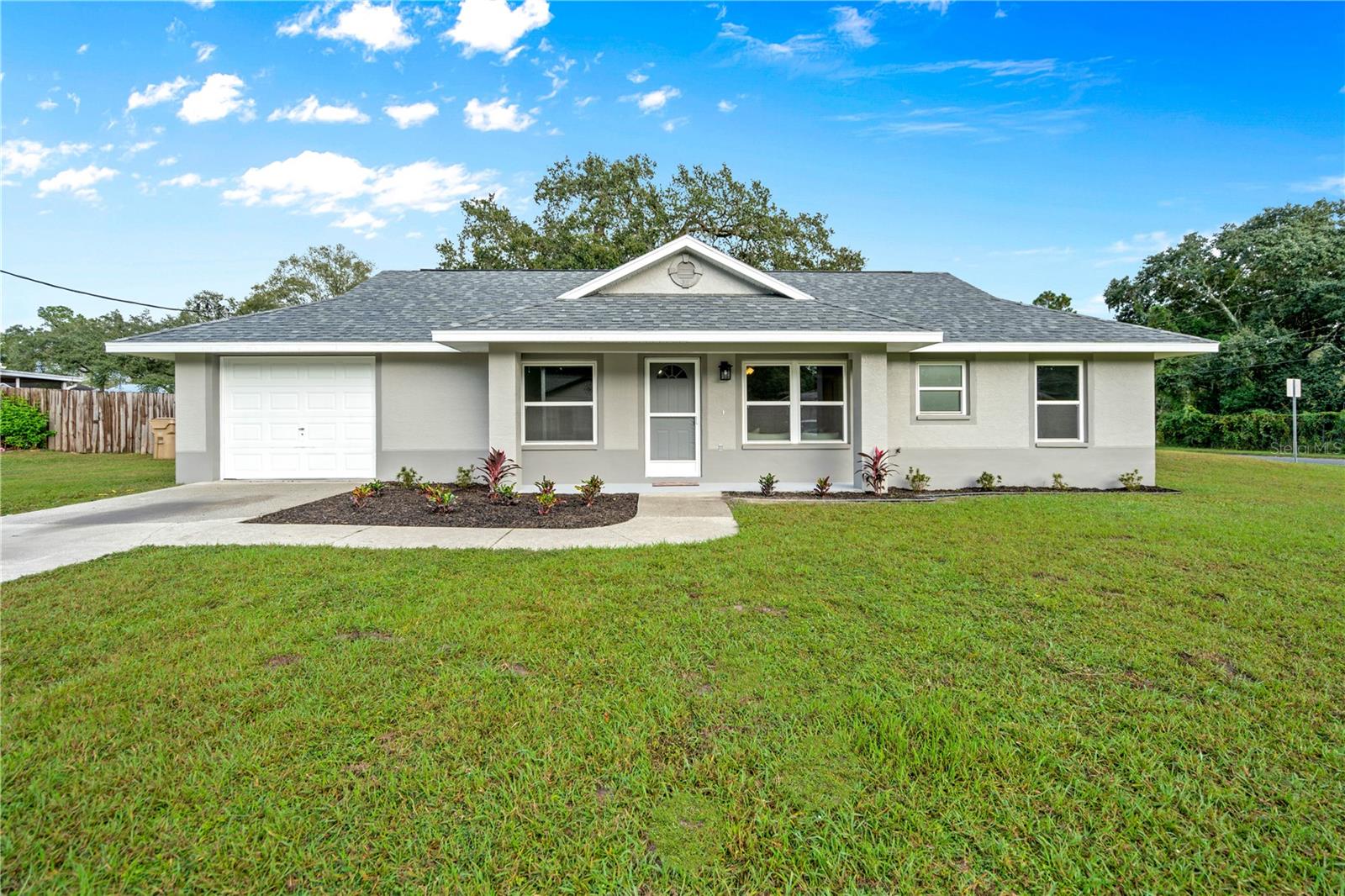 Don't Miss this San Antonio COMPLETE Remodel! This 4 Bedroom 2 Bath 1 Car Garage home has recently been renovated with a New Roof, New AC, New Windows, New Floors, New Kitchen, New Doors, New Bathrooms, & No Popcorn Ceiling. The kitchen features white shaker kitchen cabinets, level 3 granite, stainless single bowl undermount sink, & stainless steel Whirlpool Gold appliances. Each room features craftsman trim, laminate vinyl plank hardwood floors, new light fixtures, replaced outlets & replaced electrical switches. The bathrooms feature solid surface countertops, upgraded tile bathrooms with tile niches in each bathroom, & new vanities. Enjoy your 35x12 foot screened in back porch & 12x12 foot covered patio from your large corner lot. Aside from the home, you can't beat the location of this home! Near I-75, this home is perfect for a quick commute to Tampa. Also, this home is 4 minutes to Publix & the new Mirada Lagoon neighborhood. Located right in San Antonio, enjoy this quaint town or head into Downtown Dade City for shopping, entertainment, & delicious food options. You can't been this location!