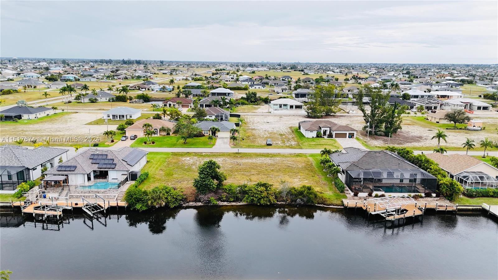 Imagine the possibilities with this magnificent gulf access lot, perfectly positioned on Watermelon Canal in the highly desirable part of NW Cape Coral. As you envision your future here, you'll be captivated by the tranquil views and the peaceful atmosphere. It's more than just living; it's about experiencing a lifestyle that balances comfort and relaxation with the excitement of coastal living. Strategically located just east of Old Burnt Store Rd, this lot places you minutes away from the open Gulf waters with only 1 bridge with 9’ clearance. The potential for waterfront bliss is endless, from boating escapades to tranquil evenings by the water with amazing sunsets. With brand new homes being built this area is highly sought after. Also the upcoming 7 Islands development elavates this opportunity, promising a host of new amenities including fine dining, shopping, and recreational activities. This addition will not only enhance your lifestyle but also add value to your investment. Don't let this opportunity sail away. Secure your piece of paradise in NW Cape Coral, where your dream waterfront lifestyle awaits. Build your dream home here. If you need a builder I can help there too.