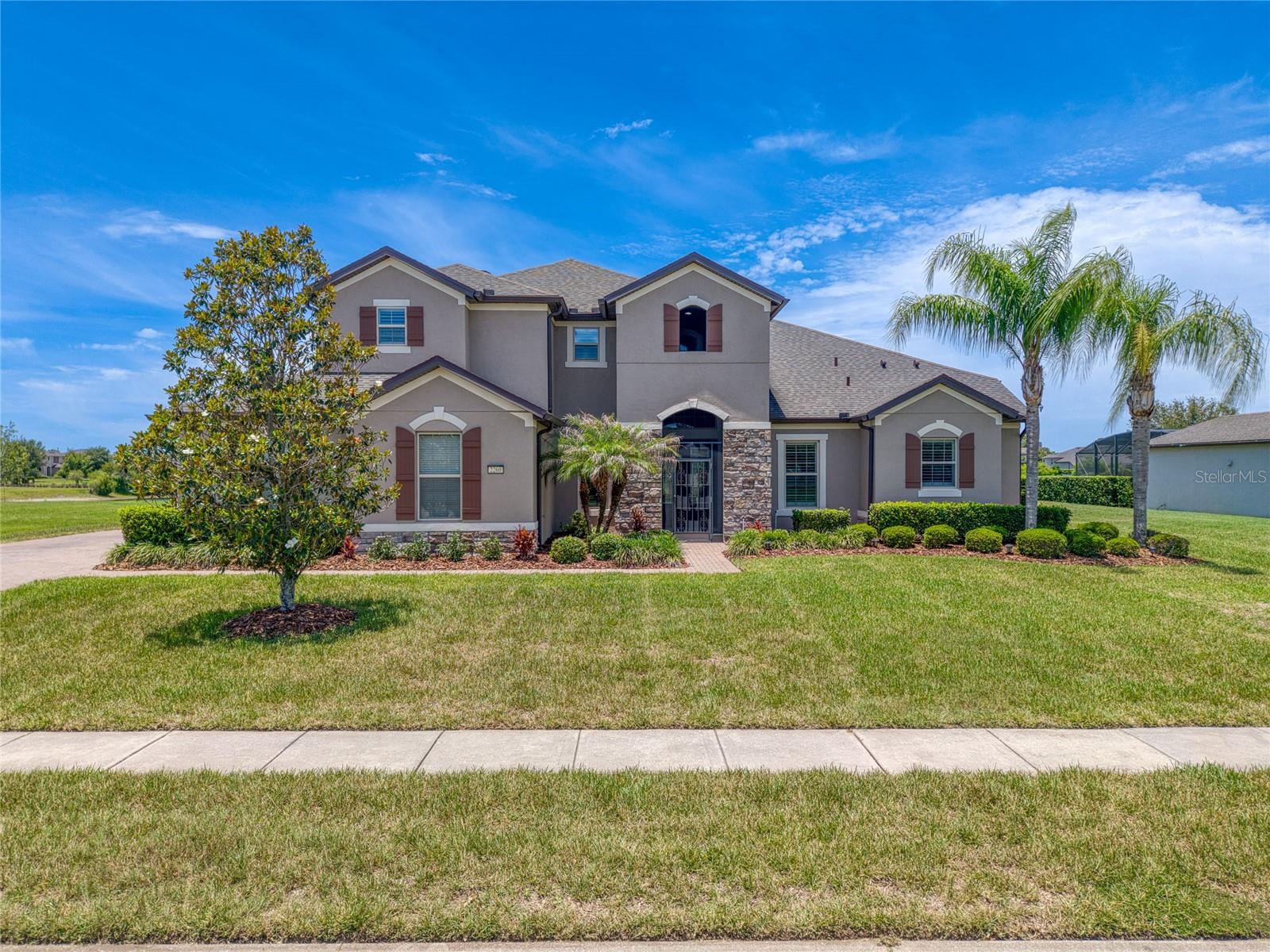 Beautiful home located in the gated community of Lake Pickett Reserve!! 
This quiet, lakeside community features only 52 homes, all on 1/2+ acre-sized lots, and homeowners have private deed access along with boat ramp for Lake Pickett, which is exclusively available only to select neighborhoods in the local area.  Home boasts 5 beds, 4 full baths, over 4,300 sqft, den/formal dining, large bonus room with French doors on main floor that could easily function as either a 6th bedroom or flex space/home office! Chef style kitchen, stainless steel KitchenAid appliances, open concept to living and dining space, extra-large loft on 2nd floor with wet bar, mini fridge, and full 5th bedroom with full bath upstairs as well.  Large Master suite with 2 closets and huge bathroom!! Laundry room fully remodeled with quartz countertops and custom cabinetry for much needed storage and workspace. Brand new, whole home wood shutters and SmartDrapes provide ample privacy along with flexibility to allow in as much natural light as desired. Outside is an expansive, screened-in paving stone patio area perfect for entertaining, enjoying the outdoor water view, or adding your own private pool oasis! With a huge backyard green space, options are endless! Located near Waterford Lakes and tons of shopping & restaurants, right around the corner from Oviedo and UCF campus, less than 35 miles to Disney, Universal Studios, Sea World, and so much more!