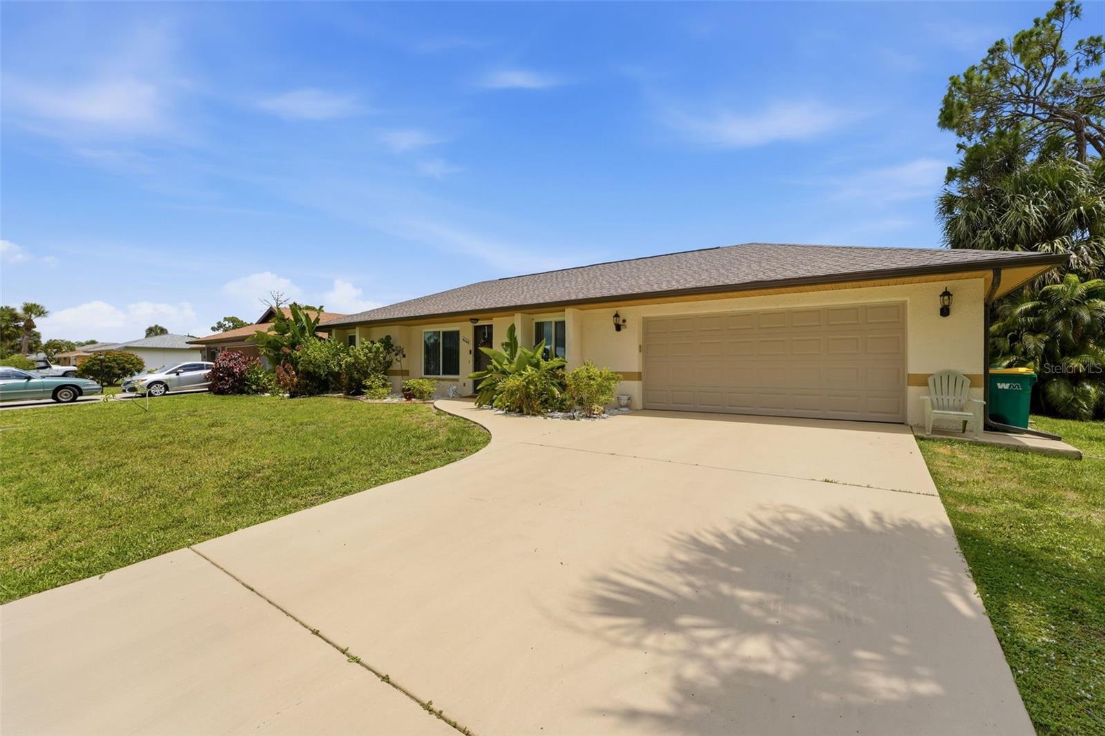 Whether you're buying your first home or searching for the perfect seasonal escape, this move-in ready 3-bedroom, 2-bath block and stucco home checks the boxes that matter most. The major updates are already handled: a 2023 roof, impact-resistant windows and front door (2020), an impact garage door (2015), a 2.5-ton 16 SEER A/C system (2019) with a Nest smart thermostat, and an updated electrical panel (2021) — peace of mind and lower insurance heading into every storm season. Exterior cameras add an extra layer of security, ideal for snowbirds who lock up and head north.
Inside, vaulted ceilings and easy-care tile flooring run throughout a bright, open living and dining space filled with natural light. The kitchen offers white cabinetry and stainless steel appliances, while the spacious primary suite features a tastefully updated bath.
Out back, a generous screened lanai opens to a large, private yard framed by mature tropical palms — plenty of room for the dogs to run and space to add the pool of your dreams. A 2-car attached garage completes the package.
Minutes from Port Charlotte's parks, shopping, dining, golf, and the Gulf beaches of Englewood and Manasota Key. Schedule your private showing today!
