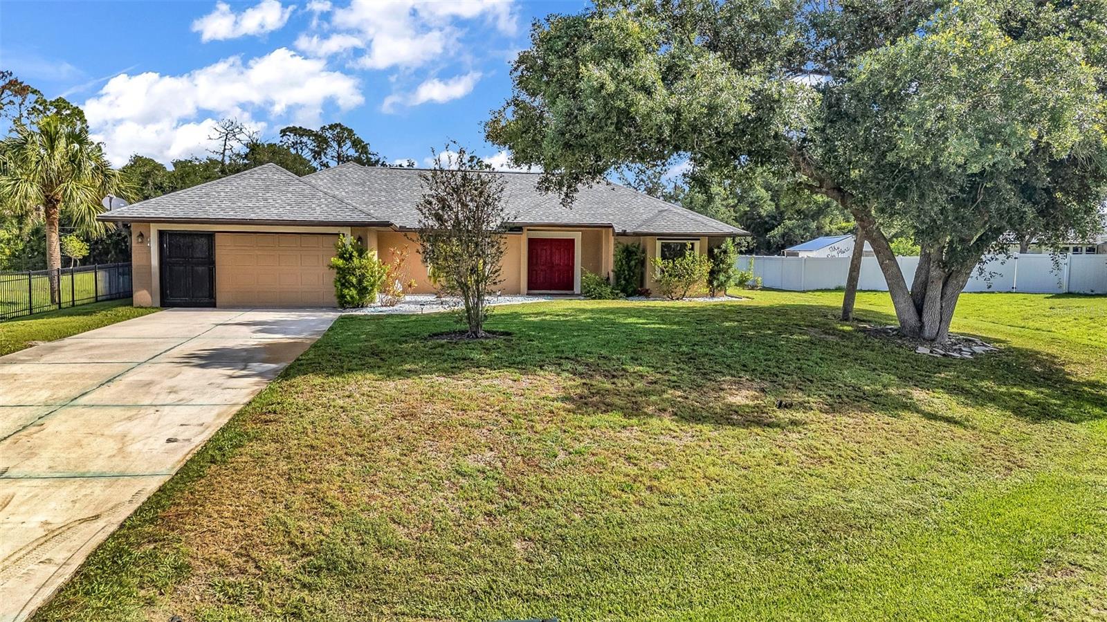 Spacious 3-bedroom, 3-bath pool home with a 2-car garage situated on a cul-de-sac lot in North Port! Featuring tiled floors throughout, a split-bedroom floorplan, separate family and living rooms, granite countertops, wood cabinetry, and an open layout designed for comfortable everyday living. The screened and pavered pool area creates the perfect space for relaxing or entertaining while enjoying the maintained landscaping and oversized lot. Built in 2003 with over 2,000 square feet of living space, this home also offers a hip roof, attached garage, and convenient access to shopping, dining, schools, and I-75. Located in Flood Zone X  and roof thats only 3 years old for added peace of mind.