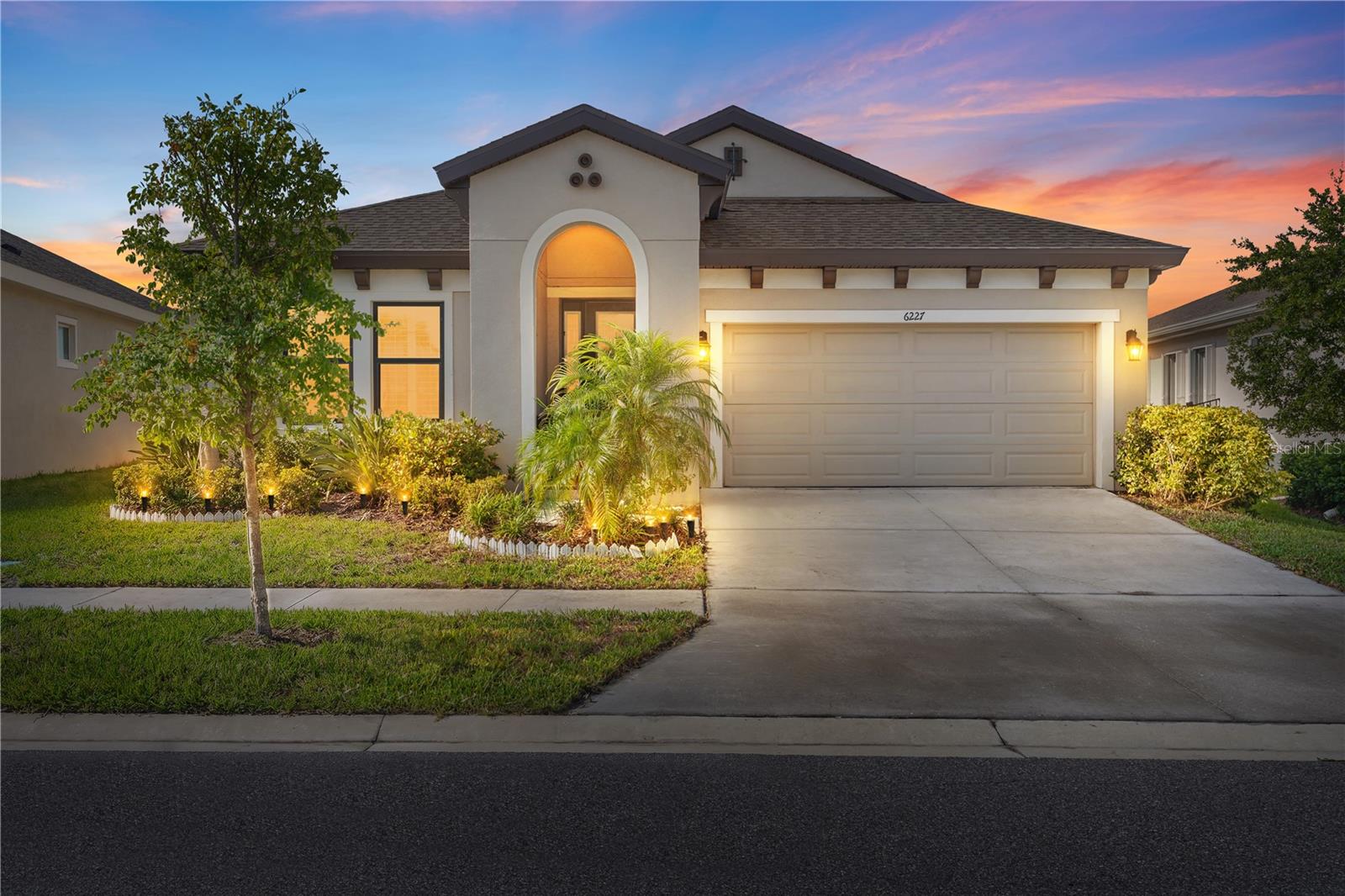 Virtually Staged. Located in Apollo Beach’s sought-after Waterset community, this thoughtfully designed single-story residence offers 3 bedrooms, 3 full baths, a private office, and a layout built for both everyday comfort and entertaining. The home welcomes you with a paver driveway, an attractive glass-entry door, and energy-efficient double-pane windows. Inside, abundant natural light highlights the open living spaces, while farmhouse-style wood shutters add warmth and character throughout. At the heart of the home, the kitchen is equipped with quartz countertops, soft-close cabinetry, stainless steel appliances, under-cabinet lighting, and a large single-basin farmhouse sink. Gas and electric cooking connections provide added flexibility for the home chef. The primary bedroom serves as a relaxing retreat with a spacious walk-in closet and an ensuite bath featuring stone countertops and a frameless glass shower. The secondary bedrooms are positioned near full bathrooms, offering comfort and privacy for family members or overnight guests. Enjoy Florida living from the screened lanai, complete with power, ceiling fans, no-see-um screening, and cable connections. The fenced backyard, well-kept landscaping, and exterior shade shutters create a private and inviting outdoor setting. Waterset offers an impressive collection of community amenities, including resort-style pools, a spa, clubhouse, fitness center, dog park, game room, playgrounds, walking and fitness trails, grilling areas, and courts and fields for tennis, basketball, volleyball, and soccer. This home combines a flexible floor plan, upgraded features, and access to one of Apollo Beach’s premier community lifestyles. Schedule your private showing today.