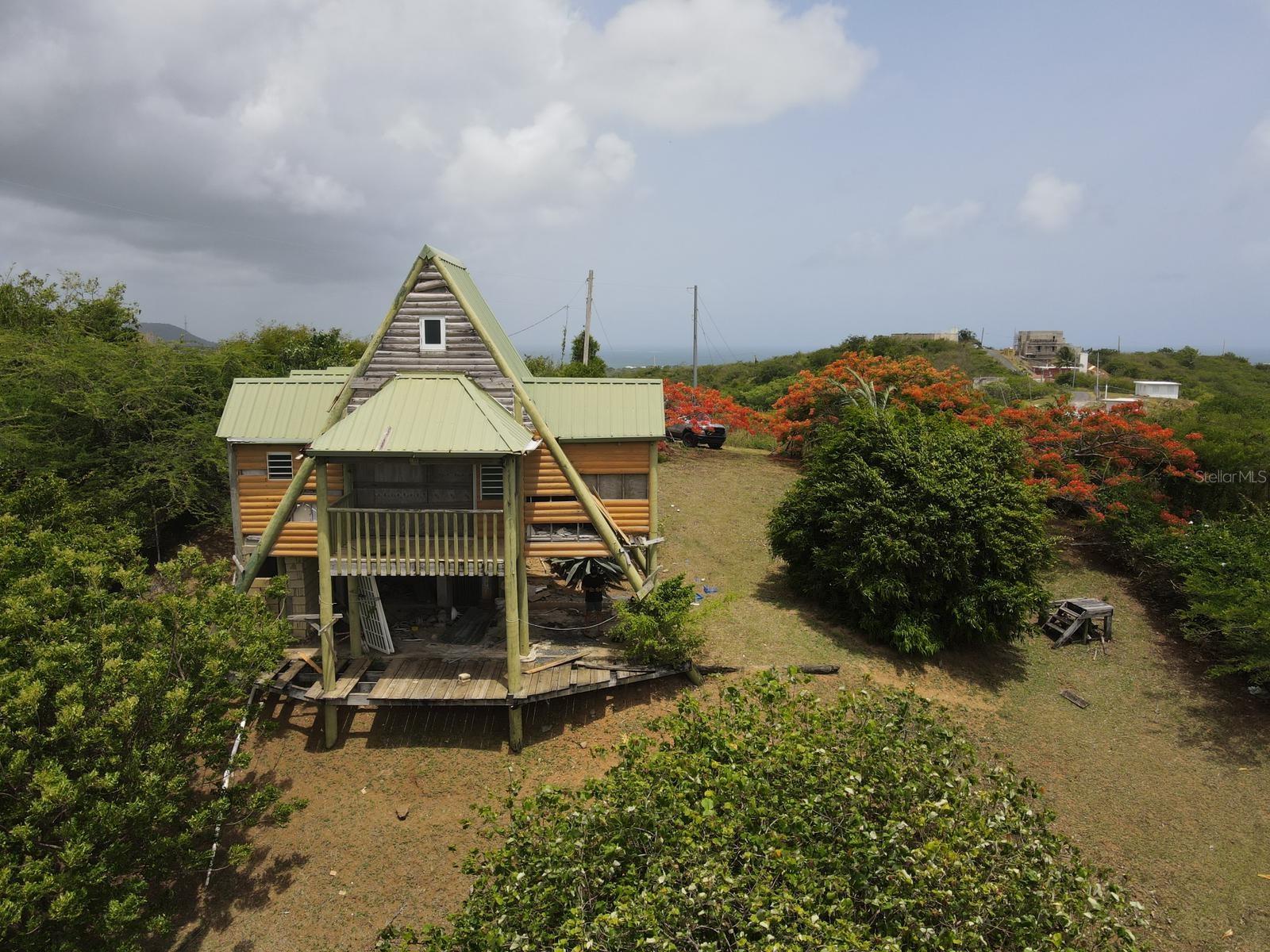 Wooden cabin located on a breezy hill in Vieques.  It need repairs.  Less than ten minutes drive from the port.  Cash only.