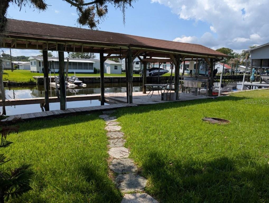 Enjoy the peaceful waterfront lifestyle with this charming mobile home situated on a canal with direct access to the beautiful St. Johns River. Whether you enjoy fishing, boating, or simply relaxing by the water, this property offers endless opportunities to experience the best of Florida living.

Step outside to your private boathouse, complete with a spacious deck that's perfect for entertaining, enjoying your morning coffee, or taking in the serene canal views. A convenient fish-cleaning station & sink makes it easy to clean your catch after a day on the water.

The home offers plenty of potential for someone looking for a weekend retreat, seasonal getaway, investment opportunity, or a place to make their own. Best of all, there are **NO HOA FEES**, giving you the freedom to enjoy your property without additional restrictions or monthly dues.

Affordable waterfront properties with direct access to the St. Johns River are hard to find—don't miss this opportunity!