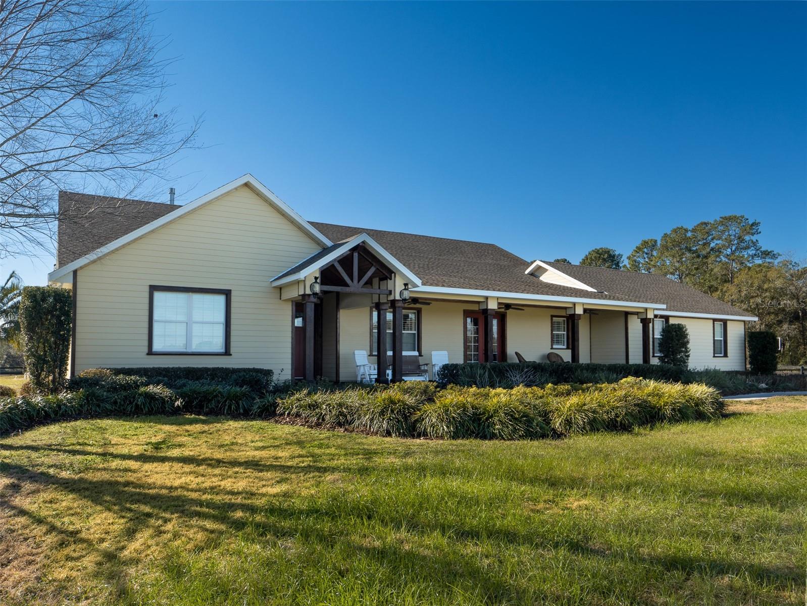 This beautiful property is perfectly located just 10 minutes from the World Equestrian Center and 5 minutes from HITS, making it an ideal spot for equestrian enthusiasts! Fully fenced and featuring 9 paddocks, the property provides ample space for your horses or a variety of other uses. The home offers 4 bedrooms and 4 full bathrooms, with an open floor plan that provides a spacious, inviting atmosphere. High ceilings and an abundance of windows to let in natural light, while the breakfast nook and separate formal dining area offer flexibility for both casual and formal meals. French doors lead out to a spacious screened-in back patio with a heated pool and spa, perfect for relaxing or entertaining. This property combines the tranquility of country living with proximity to top equestrian venues, making it a fantastic place to call home!