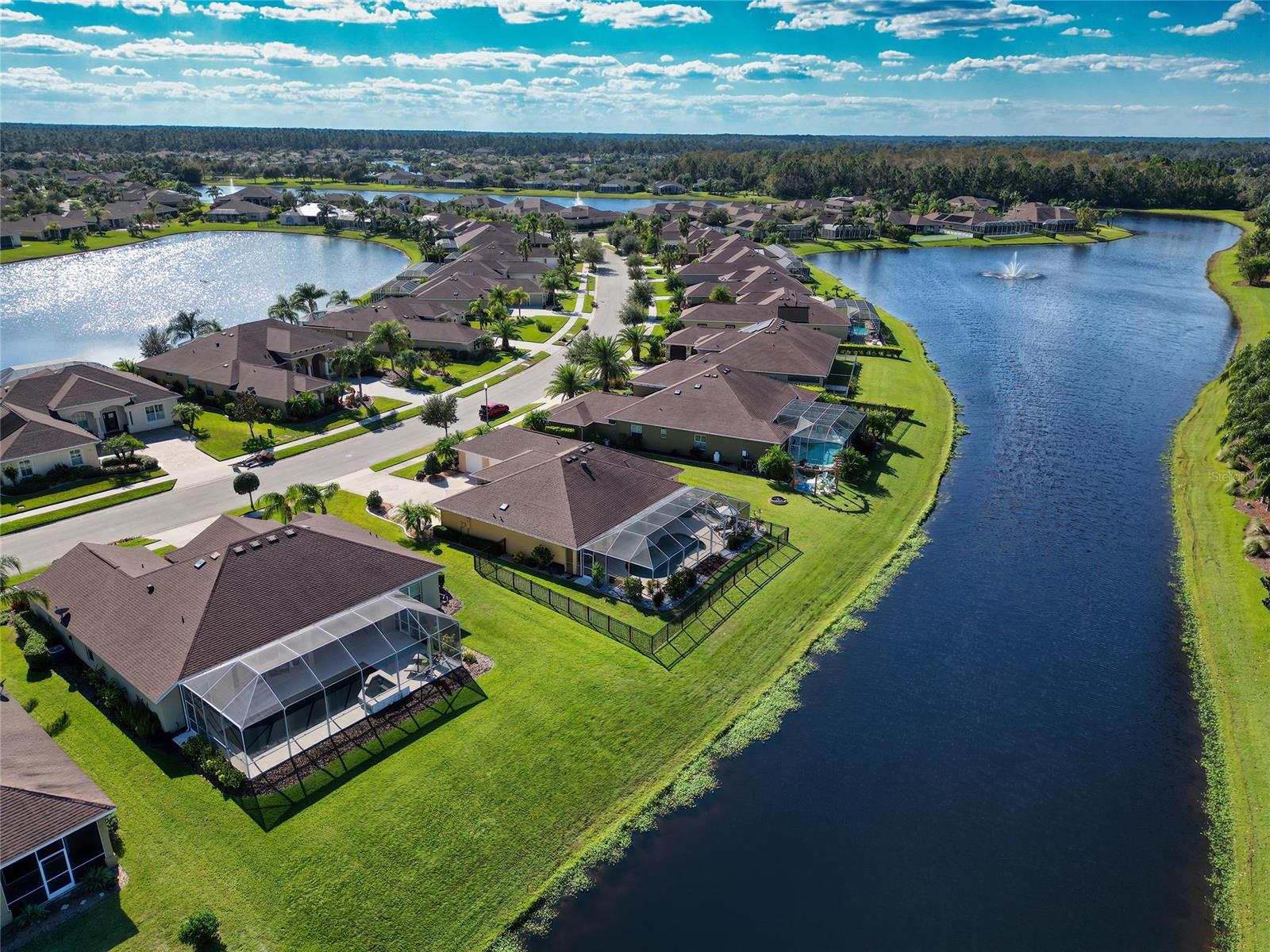 Discover your dream home in the sought-after PROMENADE PARKE AT VENETIAN BAY golfing community! First glance provides an impressive OVERSIZED DRIVEWAY with parking pad, 3-CAR GARAGE, and beautiful landscaping. The outdoor space includes a large COVERED PORCH and pool deck for plenty of room to enjoy those long summer days along with a CONCRETE PAD for grilling or a raised garden bed. Enjoy pool parties all year long as this SALT WATER POOL has SOLAR HEATING. The remaining yard is FENCED in without hindering your gorgeous WATER VIEW. This 3 bedroom, 2 bathroom, plus office SPLIT FLOOR PLAN has been meticulously maintained & cared for by its original owner. As you walk through the home, you will be greeted with an abundance of daylight and beautiful views of your new backyard oasis. With TILE FLOORING, PLANTATION SHUTTERS, and CUSTOM VERTICAL DOOR BLINDS throughout, this home has more than the average upgrades, including a beautiful WOOD PLANKED WALL in the family room. The front of the home includes an OFFICE with french doors that overlook the spacious kitchen, family and dining rooms. Just off the family room is the master bedroom which has a sliding door complete with CUSTOM BLACKOUT BLINDS that open to the generous sized POOL DECK and COVERED PORCH to bring the outside in! The master bathroom includes a DOUBLE VANITY, plenty of storage between the linen and walk-in closet, and an additional makeup vanity. The kitchen is the heart of this home with SOLID WOOD CABINETS, plenty of counter and storage space and a KITCHEN ISLAND to make all of your culinary dreams come true! There is a breakfast bar and eating nook for plenty of room that includes another sliding door to the pool deck. Off of the kitchen is the LAUNDRY ROOM with a UTILTY SINK and a large linen closet. Continue through the back of the house to find the remaining 2 bedrooms and a shared bathroom with an UPGRADED SHOWER and a door that leads to the pool deck. Within close proximity to beautiful NEW SMYRNA BEACH, boutique shopping, locally owned restaurants, and EASY ACCESS TO ORLANDO!  The Club at Venetian Bay offers a PUBLIC GOLF COURSE, CLUB HOUSE, SPA, and plenty of other amenities for a separate membership fee! Schedule your showing today!