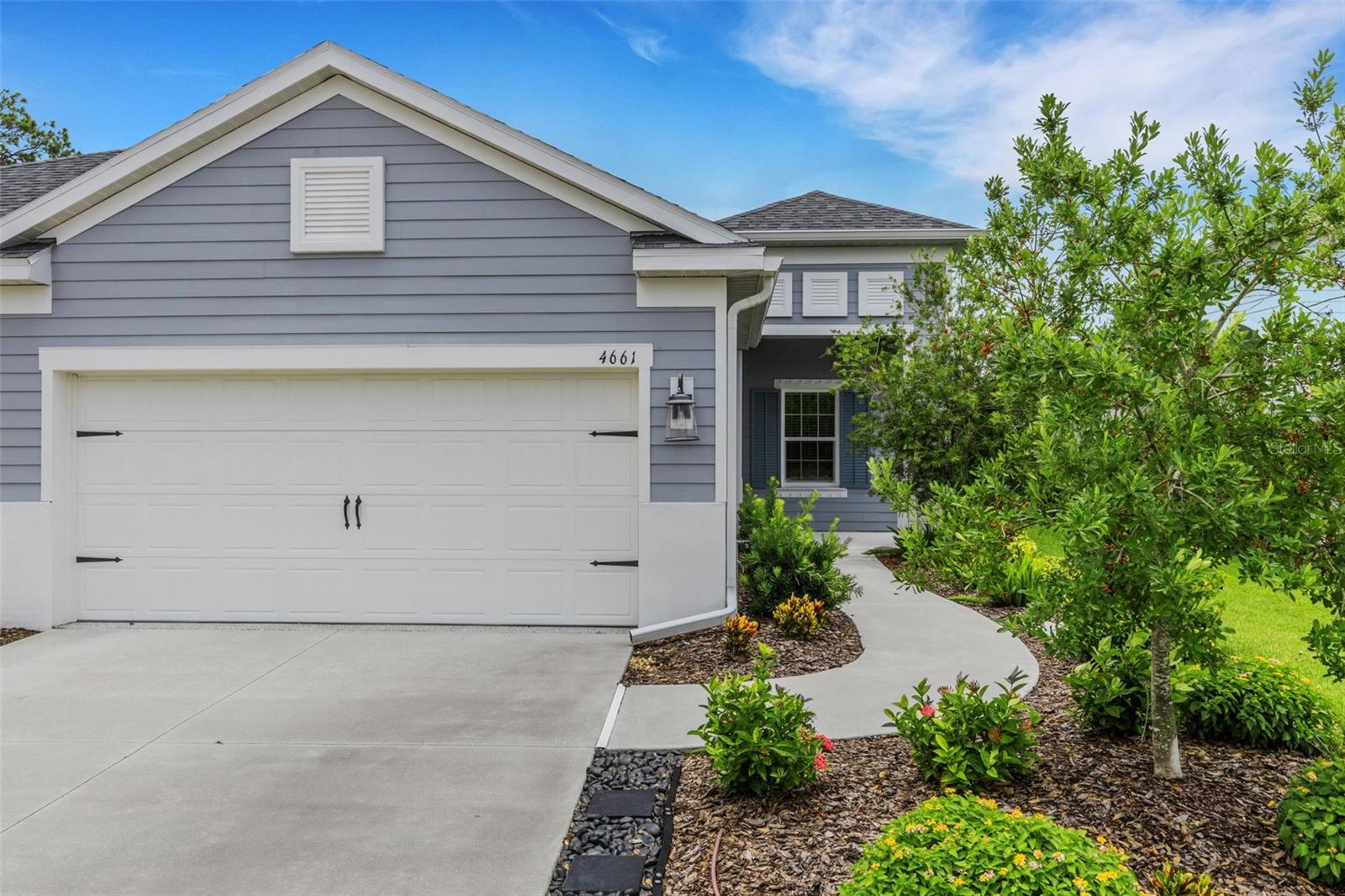Welcome to easy Florida living in the heart of up-and-coming Parrish! This beautifully upgraded 2-bedroom, 2-bath villa is only 3 years old and offers 1,525 square feet of stylish, low-maintenance living. Step inside and you'll immediately notice the gorgeous wood-look tile flooring, upgraded light fixtures, ceiling fans, 2-inch wood blinds, and elegant tray ceiling in the living room. The spacious kitchen is designed for both everyday living and entertaining, featuring a large center island, gas range, pantry with a custom-made door, and an abundance of cabinets and drawers for exceptional storage. The primary suite is a relaxing retreat featuring a large ceiling fan, two closets—including a spacious walk-in closet—a dual-sink vanity, and a large walk-in shower. The living area is equally impressive with a stunning TV accent wall and fireplace, creating a warm and inviting focal point.

A RARE OPPORTUNITY! The attached villa next door (D6148146) is also available for purchase, creating a unique chance to own both sides! Imagine the possibilities—live in one villa and use the other as a potential rental or investment property, create the perfect multi-generational living arrangement with parents on one side and adult children on the other, or keep family and friends close while everyone enjoys the privacy and independence of their own home. Whether you're planning for extended family, looking for additional income potential, or simply want the flexibility that owning two neighboring residences can provide, opportunities like this don't come along often!

Whether you're looking for a full-time residence, seasonal getaway, investment opportunity, or a unique multi-generational living arrangement, this move-in-ready villa offers the flexibility and Florida lifestyle you've been searching for. Come see all the possibilities and make this exceptional opportunity your own! Enjoy Florida's indoor-outdoor lifestyle from the large screened lanai, perfect for morning coffee, evening cocktails, or entertaining friends. Additional garage storage helps keep everything organized and tucked away. The location within the neighborhood couldn't be more convenient—you'll be directly across the street from the community pool and mailboxes! Just across the road, residents also enjoy access to the amenities at Canoe Creek, including an additional larger pool, pickleball courts, a state-of-the-art fitness center, community room, walking trails, 2 dog parks and so much more. Parrish is one of Florida's fastest-growing Gulf Coast communities, offering a relaxed lifestyle while keeping you within easy reach of shopping, dining, entertainment, and some of the area's most popular destinations. Spend your days exploring the beautiful Gulf Coast beaches of Anna Maria Island, St. Pete Beach, and Siesta Key, then come home to your own peaceful Florida retreat.