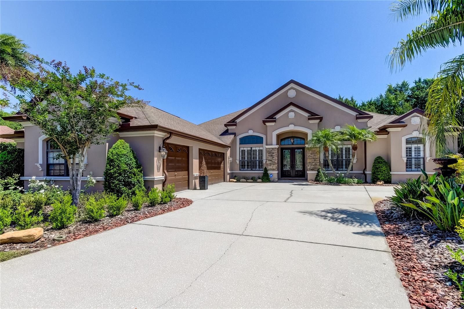 AMAZING! Located in EXCLUSIVE, Private, Man-GUARD GATED COMMUNITY of Grey Hawk at Lake Polo! BREATHTAKING, PEACEFUL, POND VIEWS on a QUIET CUL DE SAC! NO REAR NEIGHBOR! AMAZING CURB APPEAL! IMMEDIATE OCCUPANCY!! Double Leaded Glass Door Entry! DESIRABLE OPEN CONCEPT! Great Room Floor Plan Featuring Tray Ceilings and Crown Molding! FIREPLACE! Separate Dining Room Space or Additional Sitting Area! Chef's Kitchen! 42 inch Hardwood Cabinetry! ISLAND Great for Prep Work! Tile Backsplash! NEWER STAINLESS REFRIGERATOR! Pantry! Breakfast Bar Great for Entertaining! You WILL LOVE the Large Mitered Glass, Aquarium Window that overlooks your Expansive Covered Lanai with Gorgeous Views of Lush, Tropical Landscaping! Neutral Decor! FRESHLY PAINTED INTERIOR!! Plantation Shutters! Hand Scraped WOOD FLOORING! Desirable Split Bedroom Plan! Spacious Primary Retreat! LARGE WALK IN CLOSET! 3 Bedrooms PLUS OFFICE! Plenty of Storage! 2 LARGE BATHROOMS! Both have Double Sinks! Both have Walk In Closets! Desirable 3 Car Side Load Garage! NEWER DESIGNER, UPGRADED LIGHT FIXTURES and CEILING FANS THROUGHOUT! TRIPLE SLIDING GLASS DOORS Lead to the Screen Enclosed, Pavered Lanai! GREAT SPACE FOR HOSTING PARTIES FOR FRIENDS AND FAMILY! plus INGROUND HEATED SPA! Laundry Room includes NEWER WASHER & DRYER with Additional Storage Cabinets! Utlility Sink in Garage! FENCED, PRIVATE, PEACEFUL BACKYARD! Community AMENITIES INCLUDE: Tennis, VolleyBall and BasketBall Courts! Playground, Walking Trails, Dog Park and Fishing Pier overlooking Lake! Top Rated Schools! Located 1 mile West of VETERANS EXPRESSWAY! Only Minutes to Downtown Tampa, Amalie Arena, Raymond James Stadium, Tropicana Field, Zoo Tampa, Cultural Centers, Channelside and Tampa International AIRPORT!! Plus the BEST White Sugar Sand BEACHES on the Florida Gulf Coast! MUST SEE INSIDE TO APPRECIATE!