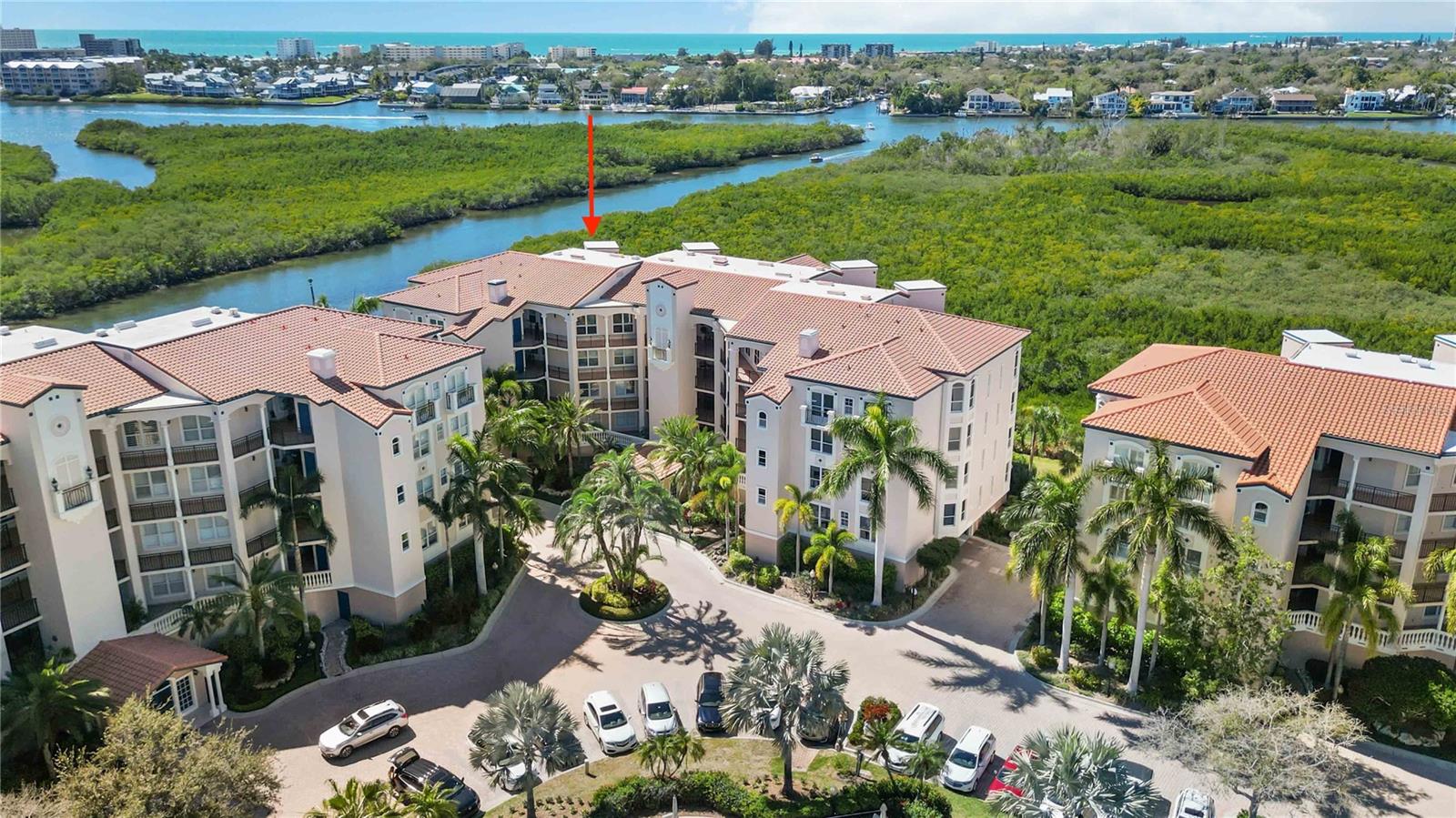 One or more photo(s) has been virtually staged. ***   Aggressive Price Drop ~ Seller is "ready to make a deal!!"   ***        "Welcome to 5430 Eagles Point Circle, PH unit 402, a breathtaking top floor residence nestled in the coveted enclave of Eagles Point at The Landings. This 4th-floor gem offers an unparalleled living experience with stunning panoramic views of the Intracoastal Waterway, Phillippi Creek, not to mentioned captivating sunsets!

Boasting a thoughtfully designed 3-bedroom, 2-bath layout, this residence welcomes you with an open and spacious split floor plan illuminated by abundant natural light pouring in through expansive windows and doors. Step out onto the covered/screened lanai to savor the picturesque water and wildlife vistas.

The kitchen is a chef's delight, featuring newer stainless Bosch and Kitchen Aid appliances, a designated breakfast nook, ample wood cabinetry, and ceramic tile floors. The living and dining area, adorned with beautiful hand-scraped hardwood floors, creates a seamless flow perfect for entertaining. Lanai access allows you to extend gatherings outdoors while enjoying the mesmerizing views.

The owner's suite is a private retreat with lanai access, panoramic water views, and a spacious ensuite bath complete with a soaking tub, separate shower, dual sink vanity, and a generously sized walk-in closet. The guest area encompasses light-filled rooms with hardwood floors, ample closets, and ceiling fans, accompanied by a well-appointed guest bath.

This top floor unit boasts 10' ceilings, crown molding, the convenience of an in-unit laundry area, and a dedicated garage parking space and lockable storage!  As part of The Landings, a 24-hour guard-gated community west of the trail, residents enjoy proximity to Siesta Key's renowned beach and downtown Sarasota's cultural delights, shopping, and restaurants.

Additionally, ownership includes membership to the Landings Racquet Club, offering eight Har-Tru tennis courts, fitness rooms, a clubhouse for social events, a Jr. Olympic-sized heated pool and spa. Immerse yourself in nature with walking trails leading to a dock and gazebo overlooking the Intracoastal Waterway. Kayak enthusiasts will appreciate the convenience of storage on the nature path, and Phillippi Harbor dry storage boat facility is just a short distance away.

Don't miss the opportunity to make this remarkable penthouse unit yours. Call the listing agent today to schedule a private viewing and embrace the luxurious lifestyle that awaits at 5430 Eagles Point Circle.