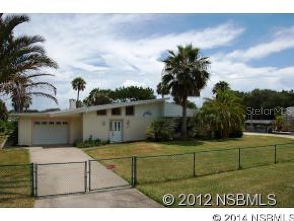 Direct Riverfront fully furnished rental.  This house is a water lovers dream!  Canals on two sides of the home with Seawalls and a boat house & dock that extends out into the ICW.  One garage on one side of the house, another on the other side.  Has large screened enclosure that runs the length of the back of house for endless river views.