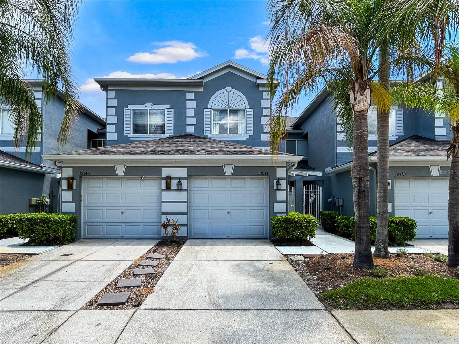 Welcome to Heritage Isles Golf & Country Club, gated community in one of New Tampa’s most sought-after communities, where resort-style living meets everyday convenience. Located within the maintenance-free Nassau Pointe townhome community, this beautifully upgraded 3-bedroom, 2.5-bath townhome offers comfort, style, and an impressive list of amenities. Enjoy peaceful pond and golf course views from the screened rear lanai on the first level, complete with patio shades that provide extra comfort during Florida’s sunny summer days, along with the convenience of an attached garage. The pond and golf course view are viewable again from the master bedroom on the second level offering serene morning views. Inside, the home features a thoughtfully designed layout with elegant upgrades throughout, including travertine marble flooring in the main living areas, wood flooring in all bedrooms, beautiful wood stair finishes, granite countertops, crown molding, stainless steel kitchen appliances, custom vanity bowls in the bathrooms, and abundant storage space. Major updates include a newer AC system replaced in 2019 for added peace of mind. The HOA provides exceptional value by covering water, sewer, trash, exterior maintenance, periodic pressure washing and painting, and roof maintenance and replacement. Residents of Heritage Isles enjoy access to outstanding community amenities including an 18-hole golf course, clubhouse with restaurant and bar, fitness center, resort-style pool with water slide, poolside café, tennis courts, basketball and volleyball courts, parks, and playgrounds. Conveniently located near top-rated schools, shopping, dining, and major roadways including I-75, this is a fantastic opportunity to enjoy the Florida lifestyle in one of Tampa’s premier golf communities.