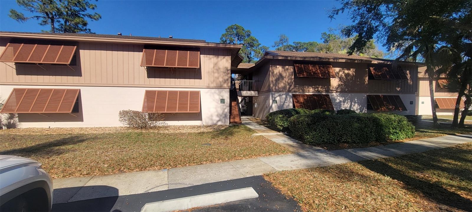 CERAMIC TILE KITCHEN & BATHROOMS, CARPET LIVING & BEDROOMST, CEILING FANS, UPGRADED KITCHEN CABINETS & COUNTERTOPS, ALL APPLIANCES, NEW WINDOWS, 1 OF BATHROOM HANDICAP MODIFIED. UNIT FULLY FURNISHED. OWNER MOTIVATED TO SELL!