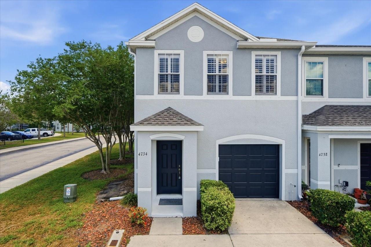 Welcome to the popular Sawgrass Community! No flood insurance required and now available is this spacious corner unit Townhome that offers 3 bedrooms and  2.5 bathrooms WITH an attached garage!!   This former Model Home shows beautifully with the creative wall cut-out features, diagonal tile and open floor plan. Once inside you will notice the high ceilings and warm atmosphere, along with the abundance of natural light that is so important and often lacking in Townhomes and Condos.   
The kitchen is a dream with dark wood cabinetry and under cabinet lighting.  There are solid surface countertops with a breakfast bar, stainless steel appliances, recessed lighting, cove ceiling detail, AND a closet pantry. Adjacent to the kitchen is the eating area which can accommodate a large table for gathering.  This all overlooks the large living area with new flooring, mood lighting and sliding doors to the screened lanai to enjoy our Florida weather.  This corner unit location also allows for no rear neighbors so that is an added plus!! There is convenient half bath downstairs across from entry to the attached 1-car garage which offers additional storage space and includes a garage door opener.
Upstairs, the oversized primary suite features plantation shutters and has an ensuite bath with double sinks, a garden tub with separate shower, and handy walk-in closet. Upstairs boosts two additional bedrooms, a full guest bathroom with tub, and a spacious upstairs laundry room with shelving for storage complete.
Additional improvements include a new roof in 2025 and A/C replaced in 2018. Located directly across the street from public parking which is so handy and convenient for guests, you are also across and a short walk from the community pool and clubhouse area.  Residents also enjoy access to a centrally located dog run. Conveniently situated near shopping, dining, and public transportation, this move-in ready home offers comfort, convenience, and a desirable Sawgrass location.
