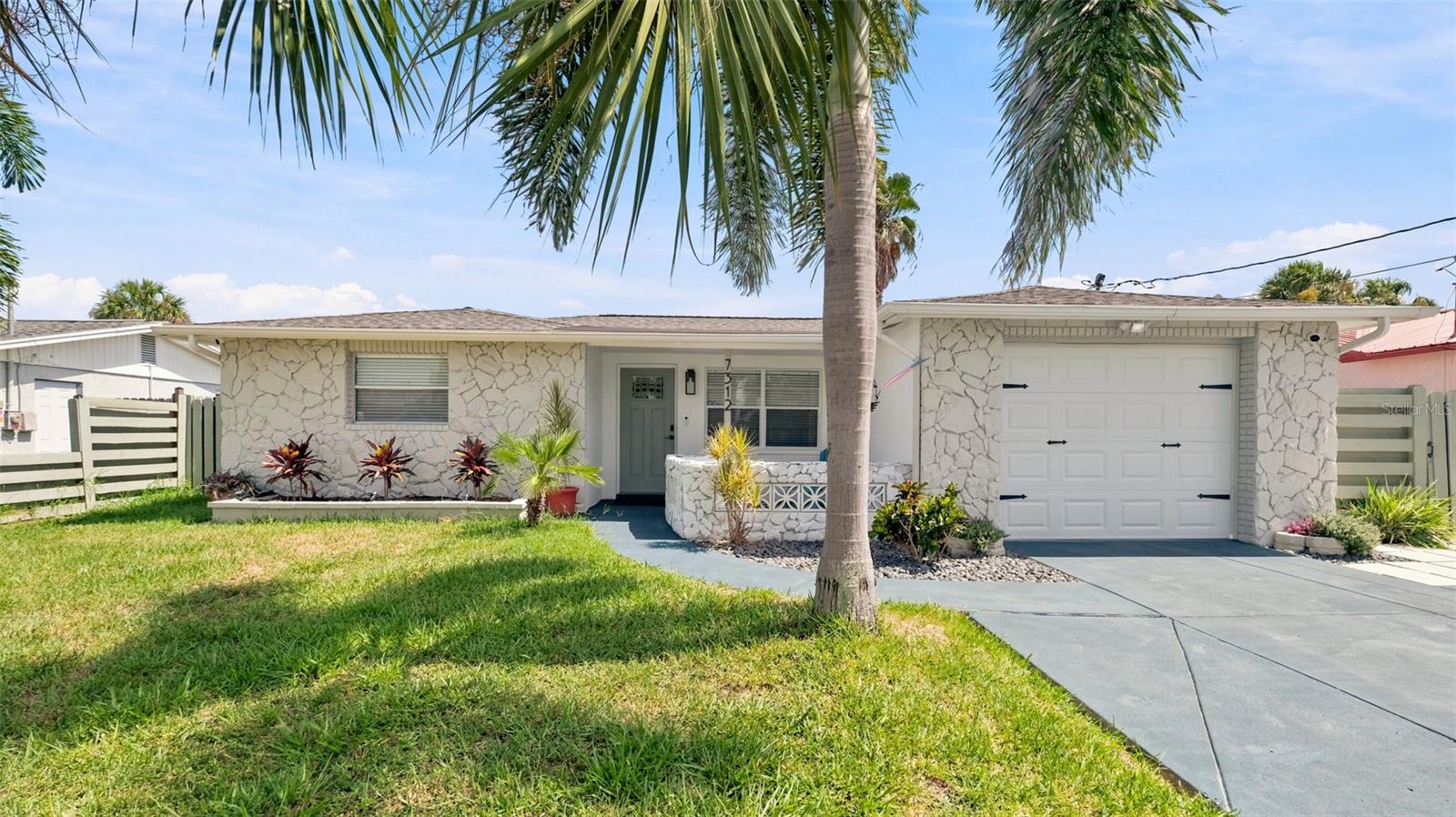 7312 Mako Dr., Hudson, FL 34667 — Welcome home to this beautifully remodeled 3 bedroom, 2 bathroom home, located in a desirable waterfront community offering easy access to the community boat ramp.

Featuring a fresh, modern feel throughout, this property has been freshly painted inside and out and offers stylish updates designed for comfortable Florida living. Major updates provide peace of mind, including a roof replaced in 2020 and AC replaced in 2017.

The spacious layout includes a cozy fireplace, updated living spaces, and a converted garage providing ample space for your primary bedroom with a fully updated primary bath.

Step outside and enjoy the fully fenced backyard with plenty of room to relax, entertain, and embrace the Florida lifestyle. The oversized driveway provides ample parking, plus an additional gate offers convenient access for storing your boat, RV, or recreational toys.

Located just minutes from local shopping, restaurants, medical facilities, and everyday conveniences, this home combines comfort and convenience with the relaxed waterfront vibe Hudson is known for. 

Spend your days boating, fishing, kayaking, or simply enjoying the coastal Florida lifestyle with easy access to the community boat ramp.

Don’t miss your opportunity to own this move-in-ready home in a fantastic waterfront community — schedule your private showing today!