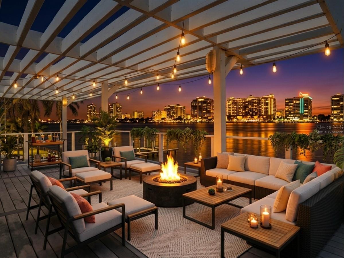 Imagine waking up every morning to the sparkling waters of the Intracoastal Waterway stretching endlessly before you, boats and dolphins gliding past your private dock, and the iconic Clearwater Beach skyline painted across the horizon. This is not a vacation — this is your everyday life.

The heart of this home is a spectacular 975-square-foot great room wrapped in floor-to-ceiling glass, delivering unobstructed 180-degree panoramic views, a dramatic spiral staircase, and multiple sliding glass doors that open directly to the waterfront. A wood-burning brick fireplace, chef's kitchen with hardwood cherry cabinetry and granite island, and sun-drenched living spaces make this home as comfortable as it is stunning.

The second-floor master suite is a true waterfront retreat with hardwood floors, a private waterfront balcony, and a spa-inspired en-suite bath featuring dual vanities, a jetted soaking tub, glass-enclosed shower, and walk-in California Closet. Two additional bedrooms each have their own en-suite baths and unique character.

On the water side, a covered rooftop pergola deck, private wooden dock, and lush tropical landscaping set the stage for the ultimate Florida waterfront lifestyle. Whether you are entertaining at sunset or casting a line from your own backyard, 1832 Venetian Point delivers a once-in-a-generation opportunity to live life on the water.