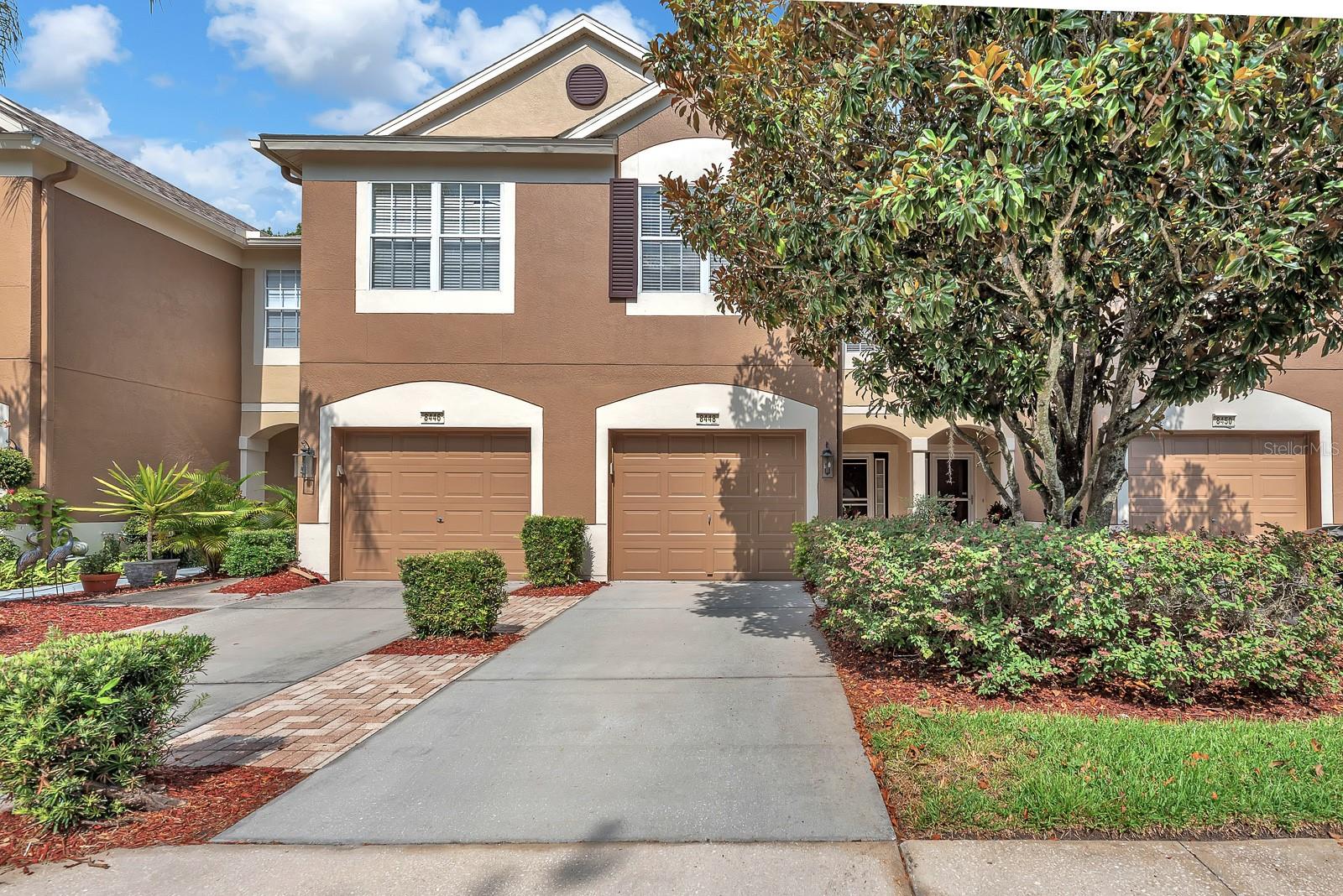 Beautifully maintained 3-bedroom, 2.5-bath townhouse with a 1-car garage located in a gated Town 'n' Country community just off Waters Avenue. This move-in-ready home features soaring ceilings, abundant natural light, and an open-concept floor plan ideal for everyday living and entertaining.

The kitchen offers solid wood cabinetry with 42-inch upper cabinets, natural quartzite countertops, a breakfast bar, and overlooks the spacious great room. Ceramic tile flooring extends throughout the first floor, while wood-look laminate flooring enhances the upstairs. Enjoy outdoor living year-round from the screened and tiled lanai.

Upstairs, the primary suite features a walk-in closet with custom storage and a private en-suite bath. Two additional bedrooms, an upstairs laundry closet with washer and dryer, and extra linen storage complete the second floor.

Additional features include no carpet, ceiling-mounted garage storage racks, a water softener (non-warranted), and an epoxy-coated garage floor. Recent updates include the roof (2022), HVAC (2021), hot water heater (2019), kitchen appliances (2019), interior paint (2019), and exterior paint (2020).

The HOA covers water, sewer, high-speed internet, basic cable, exterior insurance, roof replacement, exterior painting, grounds maintenance, trash service, and 24-hour gated security. Residents also enjoy access to the community pool. Conveniently located near Tampa International Airport, the Veterans Expressway, shopping, dining, and major commuter routes.

Whether you're a first-time homebuyer, seasonal resident, investor, or simply seeking a low-maintenance lifestyle, this move-in-ready townhouse is an opportunity you won't want to miss.