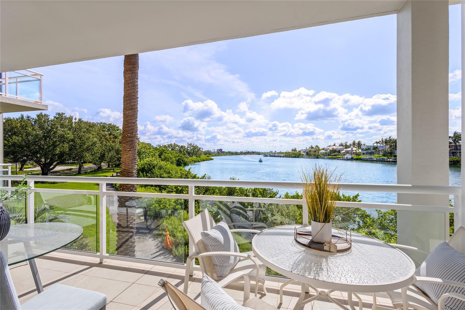 Ideal for area residents needing space for overflow guests, or for out-of-state owners who want unlimited use with the ability to still earn income! The most perfectly peaceful lagoon views are enjoyed from this first floor Junior Suite in Building 6. Unlike the other buildings, this building boasts 10' ceilings making it feel especially spacious while optimizing natural light and view. It is typical to see manatees, dolphins, paddleboarders and a variety of tropical birds from the terrace overlooking the turquoise lagoon water. Building 6 offers extra privacy as it is located across the street from the main entrance, but still close enough to enjoy the pool and beach without having to pack the car and drive anywhere. Updates to the residence include new washer/dryer, new dishwasher, new microwave, new glass shower doors, new commode, new closet shelving, and new fire alarm. This unit is not part of the hotel program; however, it can be rented out by the owner or a 3rd party vendor on a nightly basis. Owners can also become members of the Longboat Key Club to partake in the numerous Resort amenities (Golf, Tennis, Restaurants, Fitness Center, Marina) if they still want to enjoy the benefits of owning in a Resort community without being part of the hotel program.
