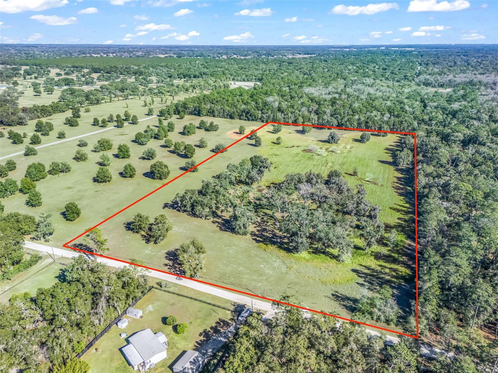 Discover 20.60 acres of prime vacant land in the heart of Marion County, Florida—an exceptional opportunity for horsemen and equestrian enthusiasts. Located just minutes (approximately 5 miles) from the World Equestrian Center and surrounded by established horse training facilities, this fully fenced property is ideally suited for a horse farm or equestrian estate. The land features majestic Granddaddy oak trees providing natural beauty and shade, a picturesque small pond, and electric already installed. Peaceful, private, and perfectly positioned in Florida’s renowned horse country, this property offers endless potential to build barns, arenas, and a custom farm setup while enjoying the tranquility of the countryside with close proximity to world-class equestrian amenities. Fenced  , electric and water  well installed . Ready to build your dream Farm