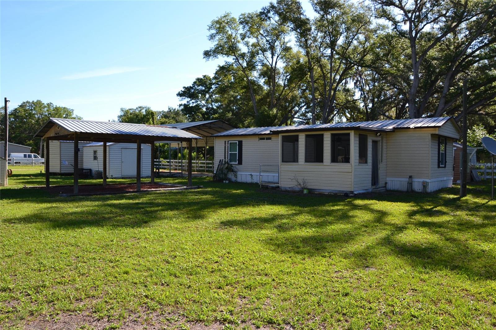 Set on a spacious half-acre lot, this property offers the kind of room and freedom that’s getting harder to find. Whether you dream of gardening, entertaining, storing your toys, or simply enjoying extra elbow room, there’s space here to make it your own. The RV hookups add incredible flexibility and convenience for travelers, guests, or anyone needing easy access for their camper or motorhome. A covered carport provides protected parking while maintaining a private, tucked-away feel that adds to the home’s quiet charm. Surrounded by the peaceful atmosphere of country living, you’ll love the slower pace, open skies, and sense of escape—without sacrificing everyday convenience. If you’ve been searching for a property with space, versatility, and a lifestyle that feels a little more relaxed, this one is worth seeing in person.