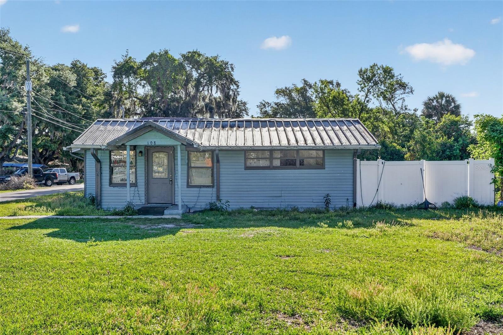 Welcome to this charming 5-bedroom, 2-bathroom home in the heart of Auburndale, FL—just blocks away from the beautiful Lake Ariana. With 1,602 square feet of living space set on a generous 0.2-acre lot, this home offers both comfort and functionality for everyday living.

Step inside to discover an open-concept layout that creates a bright and inviting atmosphere, perfect for entertaining or relaxing with family. The split floor plan provides added privacy, with the primary suite thoughtfully separated from the additional bedrooms.

The kitchen is designed with style and practicality in mind, featuring light and airy shaker cabinets that enhance the space and provide ample storage. Whether you're preparing meals or hosting gatherings, this kitchen serves as the heart of the home.

Outside, enjoy a spacious, fully fenced backyard—ideal for pets, outdoor activities, or creating your own private oasis. With plenty of room to garden, play, or unwind, this outdoor space is a true highlight.

Located in a quiet neighborhood just minutes from local amenities, parks, and the scenic Lake Ariana, this home combines convenience with a peaceful setting. Whether you're looking for extra space, a family-friendly layout, or proximity to nature, this property checks all the boxes.