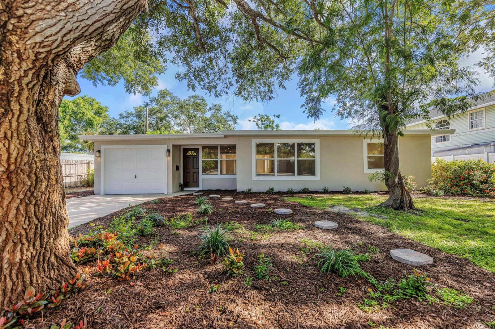 Virtually Staged. Location! Location! Location! Perfectly positioned directly across from Walter Fuller Park, this beautifully updated 3-bedroom, 2-bath home sits on an oversized 0.24-acre lot in a non-flood zone—a rare opportunity in one of St. Petersburg's most desirable neighborhoods. Major systems have already been replaced including a new roof(2019) and new AC(2019). Every inch has been thoughtfully reimagined with timeless finishes and a bright, open feel that makes the home as functional as it is inviting. The kitchen serves as the heart of the home with custom cabinetry, quartz countertops, and brand-new stainless steel appliances, while the updated bathrooms and seamless luxury vinyl flooring complete the modern, move-in-ready design. The backyard is just as impressive. With nearly a quarter acre, there's ample space for a pool, outdoor entertaining, or simply enjoying the privacy that's increasingly hard to find. What truly sets this property apart is its location. Step outside to Walter Fuller Park's walking trails, green space, sports facilities, playgrounds, and community amenities, all while being just minutes from award-winning Gulf beaches, Tyrone shopping and dining, and the energy of downtown St. Petersburg. Homes offering this combination of location, lot size, and quality renovation rarely come to market. Move in, unpack, and start enjoying everything this exceptional neighborhood has to offer.