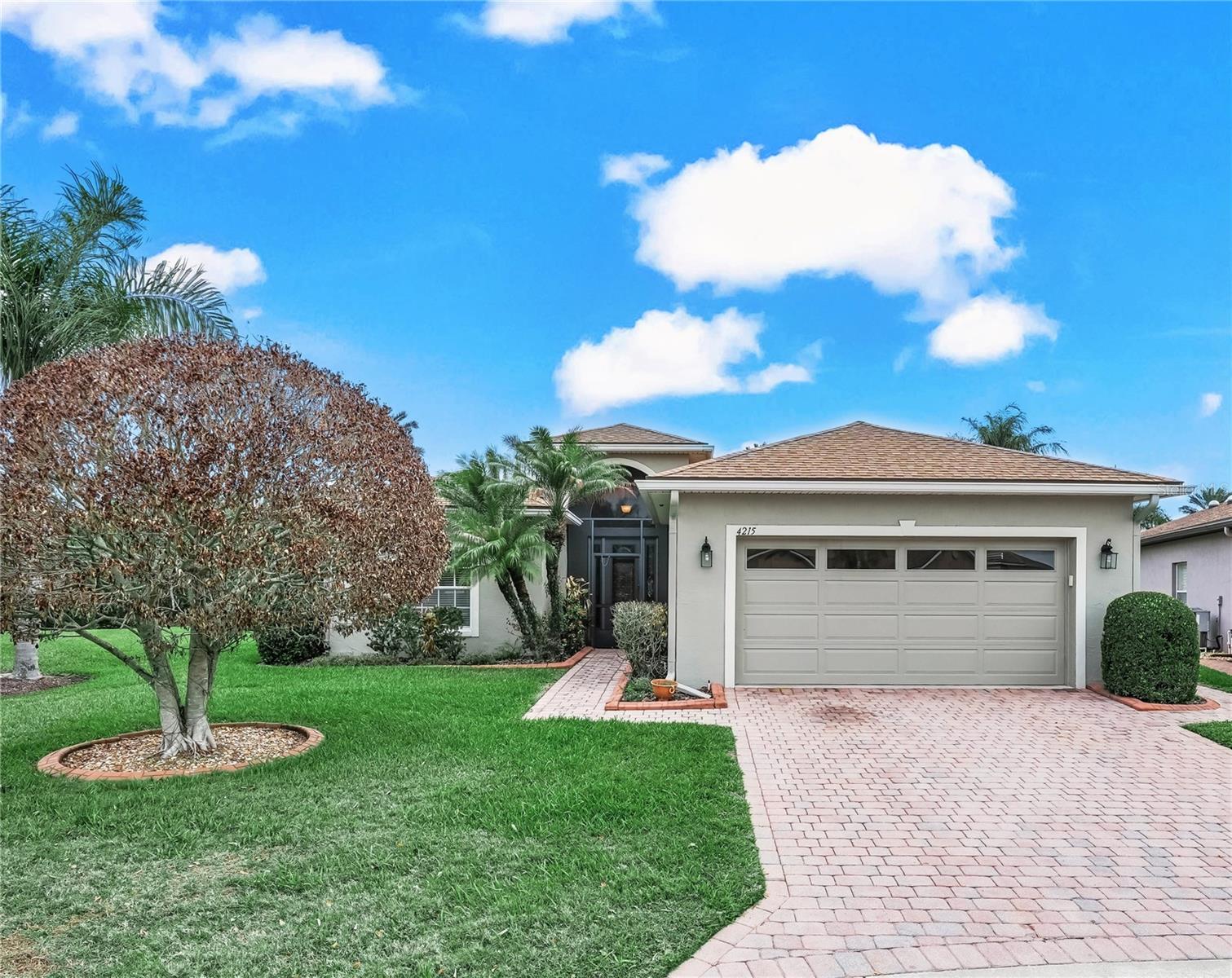 Jump in and Make a SPLASH in the POOL at this home located in Lake Ashton, a gated and guarded 55 Plus community in Florida. CDD DEBT PAID IN FULL! OVERSIZED GARAGE (29x20). This BISCAYNE Floor Plan offers 3 Bedrooms/2 Baths. Positioned on an oversized lot, this home has a solar heated salt water screened pool with water feature & overlooks the pond of the 11th Hole Island Green. This home offers excellent curb appeal with Mature/Lush Landscape, Paver Drive Way, Paver Walk Way to the Front Door and Paver Walk Way to the Outdoor Living Area. The outdoor living area features a screened swimming pool & covered lanai with tile. A portion of the covered lanai has been partially enclosed with acrylic glass transitional windows. The entrance of this home has a Screened Welcome Entry and the Front Door is beautiful. It's a Beveled Leaded Glass Door with side lights and the eyebrow window above adds a touch of class. When you step inside, the focal point is the Outdoor Pool area. The Guest Suite is to your left and the Formal Dining area is to your right. The Living Room (the center of the home) is directly in front of you and the Primary Suite is located on the back of the home. The kitchen is on the left side of the home. There are many upgrades offered in this home. The kitchen has 42" cabinets, Corian counter tops, Breakfast Bar, Solar Tube for Natural Light, Under Cabinet Lighting, Tiled backsplash, Stainless Steel Appliances, Reach In Pantry, Dinette area with window and Double Glass Sliding doors that open to the outdoor pool area.  The Living Room has triple Glass Sliding Doors that open to the outdoor living area,  and a solar tube adds natural light into the home.  The Guest Suite has a pocket door that provides privacy to the guest bedroom and guest bath. The Guest Bath has a shower/tub combo and there is a reach-in linen closet for towels and linens in the hallway.  Bedroom 3, located direclty off the LR, is a flex room. It could be used as a Bedroom, Den/Office or Craft Room. Bedroom 3 (Flex Room) has two coat closets (perfect for your storage needs) and doors that separate it from the Living Room. The Primary Suite offers a spacious Primary Bedroom and En-suite with His/Her Walk In Closets, His/Her Comfort height vanities, and Separate water room with a tiled walk in shower and Linen closet.  The Laundry Room, Washer/Dryer Included, has additional cabinets for Storage. There is a wash sink in the garage and the garage doors are insulated and glass inserts on the door allow light to fill the space. The home is wired for a generator hook up and the electric panel has a surge protector. You'll enjoy the picturesque sunrises and lake views from the privacy of your own lanai. Additional Home Highlights: Surround Sound, Irrigation System,  Whole House Gutters,  Re-Roof of Main Home (2023),  Water Heater replaced. Lake Ashton is a gated and guarded Florida Active Community with resort style amenities, 2 Clubhouses with Movie Theater, Restaurant, Outdoor/Indoor Pools, Fitness Centers and More! Residents enjoy activities like Karaoke, Trivia, Dances, Entertainment Series, Holiday Events and more. You can stay busy living the Florida Retirement Dream every single day. For those that love the game of golf, there are 2 18-Hole Golf Courses, a Pro Shop, Driving Range, Putting Green and the Eagles Nest (Hole 19). Don't wait to tour this home; tour it today! REALTORS READ THE REALTOR REMARKS