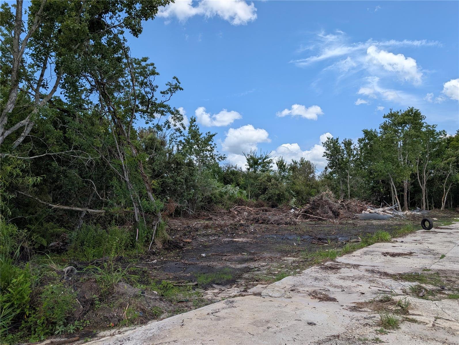 Discover the possibilities with this approximately 0.57-acre vacant land offering consisting of eight platted lots, Lots 27 through 34, with a survey available for review. Located in Bithlo near Bithlo Community Park, the property offers a more rural setting while remaining convenient to State Road 50, Waterford Lakes, UCF, shopping, dining and major roadways. No HOA provides added flexibility. County records indicate R-T-2 Combination Mobile Home and Single-Family Dwelling zoning, which may provide options for a qualifying conventional single-family residence or manufactured home, subject to Orange County approval and all applicable development requirements. Prior records also indicate FEMA Flood Zone X (not in a flood zone). The property is raw land and buyers should independently verify buildability, legal access, future land use, zoning, lot-combination requirements, permitted animal uses, wetlands, utilities, well, septic and all permitting requirements with Orange County. Bring your plans and explore the potential of owning eight adjoining platted lots in a growing area of Central Florida.