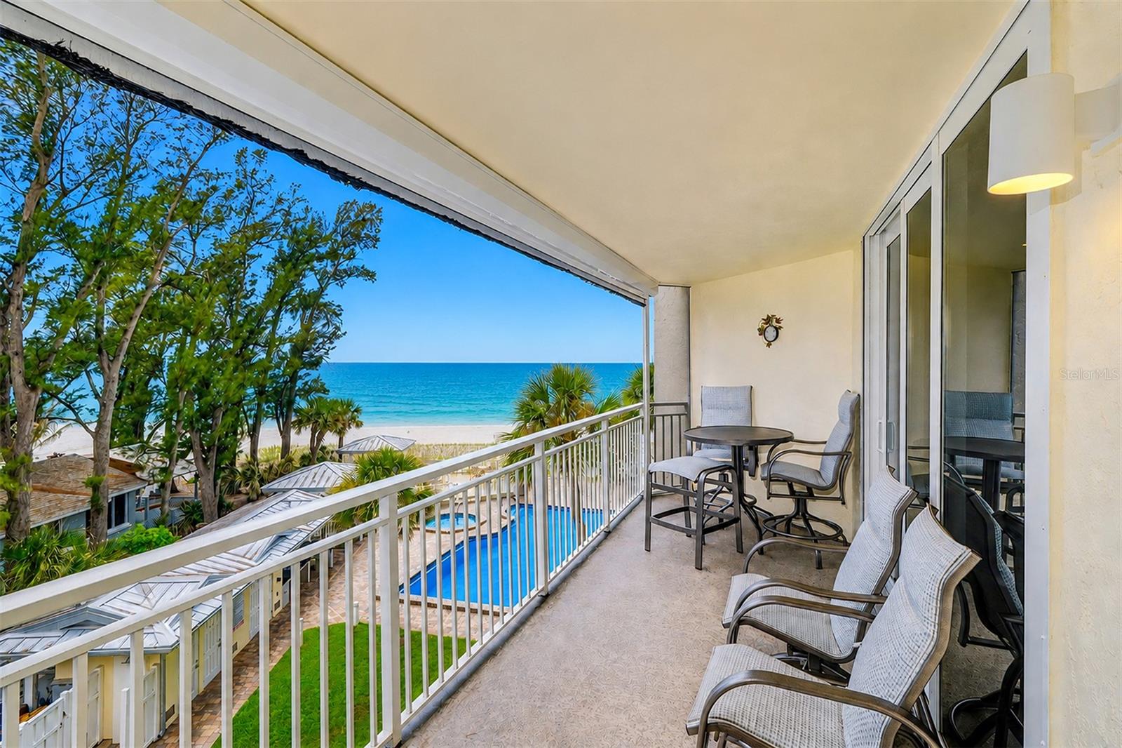 Renovated GULF VIEW / BEACH FRONT 3/2 Dolphin Reef Condo! Wake up to sweeping Gulf views and the soothing sound of waves from this perfectly positioned 3-bedroom, 2-bath condo residence directly on the sugar sands of IndianRocks Beach …….. Offered fully furnished and turn-key (with just a few exclusions), this coastal retreat is thoughtfully designed for effortless beachfront living from the moment you arrive …….. Start your mornings with coffee on the comfortable balcony furnishings as the Gulf sparkles in the distance, and end each day with breathtaking sunsets melting into the horizon while gentle sea breezes welcome you home. Here, every day feels like a vacation ……..
What makes this residence truly special? The spacious owner’s suite captures spectacular sunset views through floor-to-ceiling hurricane-impact sliding glass doors, creating a serene seaside escape. Dual electric shades in both the living room and primary suite allow you to filter the afternoon sun or enjoy complete blackout privacy for restful evenings. The ensuite bath offers a private two-room layout and connects to a large walk-in closet featuring a custom built-in organization system ……..  Elegant tray ceilings with recessed lighting on Lutron dimmer switches add architectural detail and a warm coastal ambiance throughout, while custom inlaid tilework creates the reflects the home's attention to detail and easy beachside living …….. The kitchen features luxury finishes: a FRANKE SINK, GROHE Faucets, and a sleek leathered granite breakfast bar with seating for additional guests — perfect for casual gatherings after a day at the beach. Wet bar with wine rack and ULINE bar fridge with ice offers added storage and countertop space. Retractable electric balcony screens, a tankless “on-demand” hot water heater, 2025 HVAC system, and an interior laundry room with washer and dryer included add comfort and convenience throughout …….. Residents enjoy seaside resort-style pool and spa, expansive sun deck, outdoor kitchen and bar area with BBQ grills, and new lounge furnishings surrounded by lush tropical landscaping — an ideal setting for relaxing with friends and family ……..
Dolphin Reef Condominiums is a secure, well-maintained Gulf-front community of just 40 residences featuring two elevators, gated private beach access, a fitness center with sauna, plus a 5th floor social room with billiards, TV, and kitchenette. Monthly association fees include building and flood insurance, exterior maintenance, pest control, water, sewer, trash, basic cable, and an on-site maintenance manager …….. assigned covered parking space #304 and a private climate-controlled storage closet on the 4th floor — perfect for storing beach chairs, holiday decor, etc …….. Whether you’re seeking a full-time residence, seasonal retreat, or investment opportunity, this property offers flexibility with a 30-day minimum rental policy and up to 12 occupancy changes annually …….. Pet-friendly for owners (2 pets up to 20 lbs) …….. Ideally located on the quiet North end of IndianRocks Beach, this golf-cart-friendly coastal town is beloved for its laid-back atmosphere, locally owned restaurants, and walkable beach lifestyle. Enjoy a variety of cuisines, everything from fresh seafood to waterfront dining and even a charming French bakery just blocks away. Locals affectionately call IRB “The Mayberry of the Gulf Beaches” for its welcoming small-town feel …….. CHEERS to the Florida beach lifestyle!