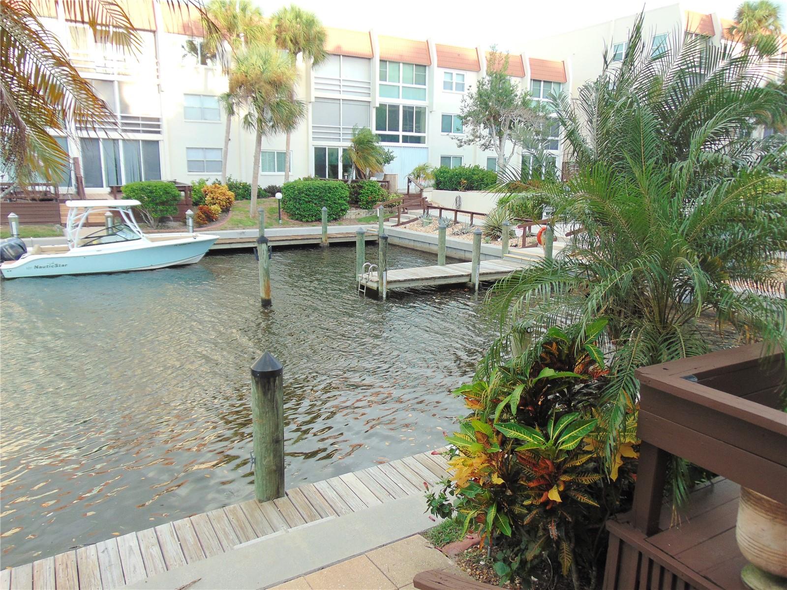 Injury forces sale, seller just dropped the price by $50,000 from the original list price of just a couple of weeks ago for immediate sale. Yes this ground floor unit has a boat dock in the back yard. Please do not hesitate on this one. Seller has people wanting to rent for the season but prefers to sell before the end of the year and can put you in contact with potential tenants for Jan-Feb & March. Excellent location on the isle of Venice, ground floor condo on a protected salt water lagoon directly off of the Bay/ICW. Boat dock is in your back yard. Seller had previously had a smaller sailboat before getting a power boat so the water is deep. No wakes to worry about as this is a protected lagoon/canal off the Bay. Your parking spot in under a carport and the spot is directly in front of the unit. The condo comes completely turn key furnished, there is a storage closet for owners to put their bikes or beach items & misc.. items into. Laundry is inside the unit and included. The condo fees also include the city water, city sewer, trash & cable tv on top of the escrow fund, maintenance costs etc.., This complex is directly on the Bay/ICW and has amazing views of the 4th of July fireworks and Christmas parade, just grab a seat on a bench or bring your folding chairs and enjoy. The Venice little theater is only a few hundred feet away as is the historical downtown shops and restaurants. Venice public beach is about a mile and the Jetties about 2 miles. You can rent this out to a new tenant every 3 months if not using it all year long. No dogs allowed but may have a kitty cat. You will be in the middle of the downtown district which has art festivals and other events through out the year. Bring a chair and hang out for free live music at the Gazebo after a nice dinner and desert from the many stores on the Ave. Available for immediate sale. You will not be sorry you looked at this one. Club house has a library, pool table, living room with a beautiful fireplace, a full kitchen, swimming pool, rest rooms with showers and plenty of places to sit and play cards, board games, chat or knit. Also there is a firepit area for conversations and several BBQs for use. Also has a day dock which is for loading and unloading passengers or coolers etc. When your looking for the best location on boat-able water with no bridges to the Gulf of Mexico with ground floor convenience and your own dock in the back yard, look no further. Can close quickly, clear title.