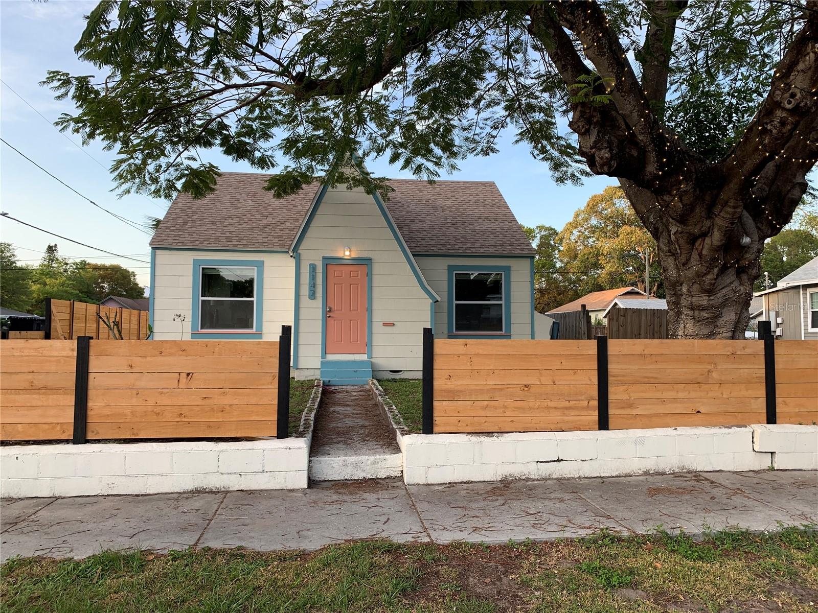 Welcome to this exquisitely renovated 1925 historic bungalow that has been tastefully updated with the home's original architecture intact! This home is situated on a desirable 50' x 124' corner lot minutes from downtown St Petersburg in the up and coming Campbell Park neighborhood, just three blocks from Historic Roser Park. This exceptional and one of a kind century home offers the perfect blend of historic charm and contemporary design. 
This beautiful bungalow home features an expansive open floor plan filled with natural light, new windows, and elegant finishes throughout. The custom designed kitchen features gleaming granite countertops, shaker cabinetry, stainless steel appliances, and a sleek smooth-top range, creating a space that is equally suited for everyday living and effortless entertaining.

The beautifully appointed bathrooms feature striking ocean blue tile, upscale slate gray vanities and contemporary fixtures.

One of the home's most distinctive features is the standalone suite on the second floor, offering exceptional flexibility for multigenerational living, extended guests, a private home office, or potential income-producing opportunities. The stairwell can be enclosed to create a private entrance.

Designed for today's lifestyle, the home offers 3 bedrooms, 2 full bathrooms, a bonus dining/laundry space, tile flooring throughout, and separate HVAC systems for each floor with independent thermostats.

This 6,200 SF lot offers your own private oasis with a fully fenced backyard which includes mature tropical landscaping, including three palm trees and a magnificent Royal Poinciana tree whose vibrant red flowering blooms create a spectacular canopy of color and shade.  The east property line is 8 feet east of fence so the lot is even larger than it looks, fence will be moved soon!

This property is zoned as NT-2 (Neighborhood Traditional Single-Family District) and Accessory Dwelling Units (ADUs) are permitted subject to the City's ADU regulations and development standards.

This home is ideally positioned just minutes from downtown St. Petersburg's award-winning restaurants, museums, waterfront parks, Beach Drive, the St. Pete Pier, Central Avenue, multiple major hospitals, and the Pinellas Trail.  The property is also only eight miles from the sugar sands of St. Pete Beach and Treasure Island, with convenient access to the SunRunner for an easy trip to the Gulf.

Whether you're searching for a one-of-a-kind historic residence, a stylish primary home with flexible living options, or an outstanding investment opportunity, this beautifully restored bungalow delivers exceptional quality, enduring character, and an unbeatable location.
This property is not in a flood zone.

Owner is a licensed real estate agent. Schedule your private showing today and discover one of St. Petersburg's most distinctive historic homes.