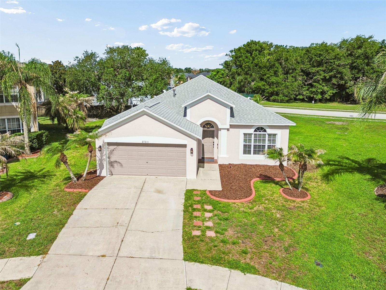Welcome to this beautifully maintained 4-bedroom, 2-bathroom home offering 1,825 square feet of comfortable living space in the desirable Saddlebrook Village West community. Thoughtfully updated with a NEW roof, NEW A/C, and NEW water heater, this home provides peace of mind and modern convenience for years to come. Step inside to discover an inviting open floor plan designed for both everyday living and entertaining. The spacious family room flows seamlessly into the dining and living room combination, creating a bright and welcoming atmosphere. Hardwood flooring throughout the home adds warmth, elegance, and easy maintenance.
The heart of the home is the large kitchen, featuring rich wood cabinetry, stainless steel appliances, ample counter space, and an oversized pantry perfect for storage and organization. Retreat to the generously sized primary suite, complete with a large walk-in closet and an impressive en-suite bathroom featuring a relaxing garden tub, spacious walk-in shower, and plenty of room to unwind after a long day. Three additional bedrooms offer flexibility for family, guests, or a home office. Conveniently located near shopping, dining, entertainment, and major roadways, this move-in-ready home combines comfort, style, and functionality in one exceptional package. Don't miss the opportunity to make this wonderful Saddlebrook Village West home your own!