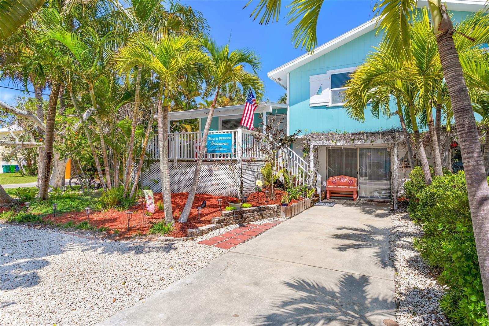 Welcome to this charming 2 bedroom, 2 bath beach house in Holmes Beach on the highly desirable Anna Maria Island. Perfect for someone looking for a private residence, a vacation getaway or an investment opportunity.  This popular vacation rental, that enjoys many repeat guests each year, comes FULLY FURNISHED & TURN-KEY READY including the recreational equipment! As you walk up the stairs to the front deck, you will see a gas grill and lovely table for delightful Al Fresco dining! When you enter the large living room, you immediately sense the casual elegance and cheerful, natural lighting. The dining room sliders open to the spacious private screened deck.The fully equipped kitchen has granite countertops with ample space for easy meal prep.  Upstairs, you will find 2 bedrooms and a hall bath.  The living room includes a sleeper sofa with a Posturepedic mattress for  extra sleeping space.  Downstairs, you will find a large game room, laundry room (with new washer and dryer) and a 2nd full bathroom.  Through the laundry room, you will find the lower back deck with a gas firepit which is ideal at night under the stars. Immerse yourself in the island's natural beauty with a short walk to the beach or hop on the nearby trolley for effortless island exploration. Drop your kayak in the nearby canal that leads to Bimini Bay and you may encounter dolphins and manatees as you paddle along! As you unwind from the day, you may want to walk to the beach to enjoy Anna Maria Island's world class sunsets.  This beach house has been lovingly cared for and meticulously maintained.  Roof (2021) A/C (2017) and serviced regularly. DishWasher (2023) Water heater (2017) Washer/Dryer (2024). Experience the unique charm of Anna Maria Island.  Don't miss out on this incredible opportunity! Call today for your private showing!