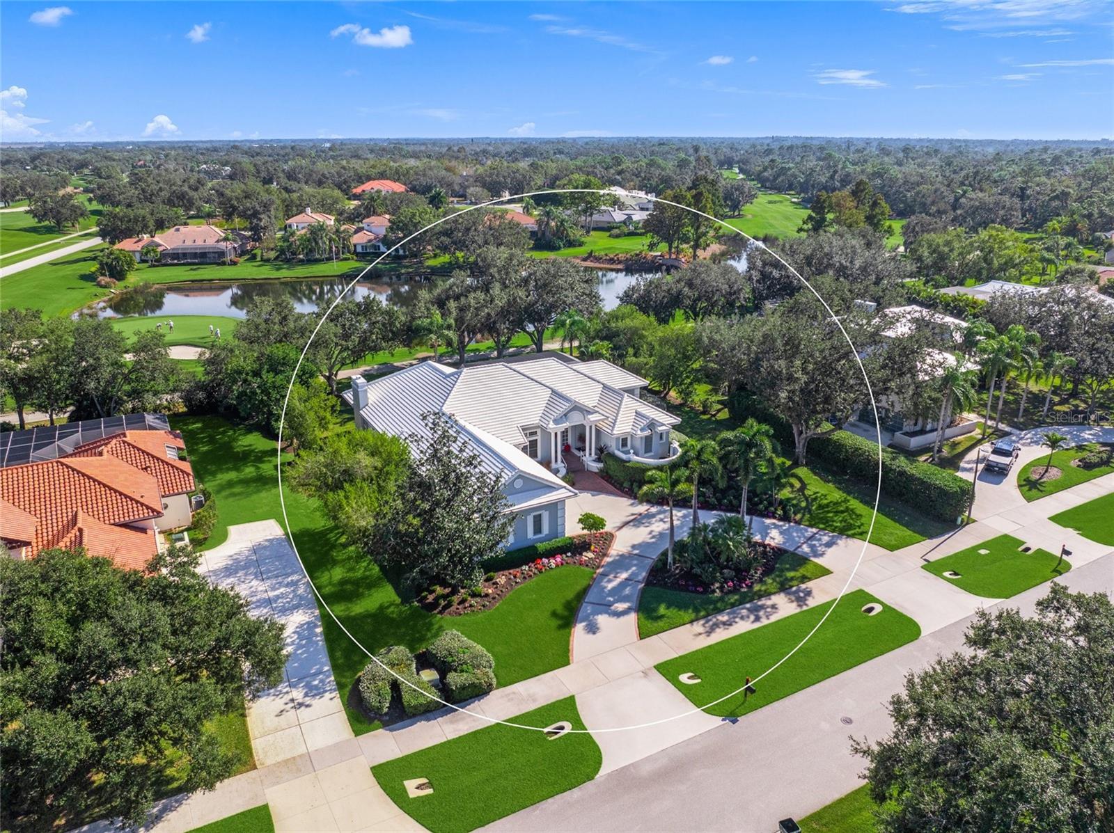This is the one * WELCOME TO LAUREL OAK ESTATES & COUNTRY CLUB, ONE OF THE MOST COVETED COUNTRY CLUB COMMUNITIES IN SARASOTA * This EXECUTIVE HOME BOASTS PANORAMIC VIEWS of a LARGE LAKE & GOLF COURSE * These are MUST SEE VIEWS * A very private setting that is perfectly positioned on OVER 1/2 ACRE * PRIDE OF OWNERSHIP SHOWS * Featuring 3 SPACIOUS Bedrooms & 3 Full Baths PLUS a Den/Office * Split Plan Design * Formal Living Room with BEAUTIFUL COFFERED CEILING * The Chef's Kitchen is stunning showcasing Double Ovens , Cook-top Island, GORGEOUS STONE Counter-tops, and ample storage * The Kitchen is open to the Family Room featuring a Wood-burning Fireplace * The Primary Suite is a true retreat with a Spa-style Bath * All of this wraps your OUTDOOR LIVING SPACE with a Panoramic Pool Cage for your Heated Pool * There are TWO Covered Lanais with a Summer Kitchen + Vented Grill * LARGE, open Backyard * Breathtaking custom landscaping throughout the property * OVERSIZED 2 Car Garage with a Separate Golf Cart Garage * This is a SPECTACULAR home with INCREDIBLE curb appeal + a classic circular driveway * Tile Roof is 8 years young * A/Cs are zoned, 3 years young & 9 years young * Volume Ceilings * 8 foot Sliding Glass Doors * This is the perfect home for entertaining or simply relaxing in your slice of paradise * A special opportunity behind the gates of Laurel Oak Estates, an outstanding Country Club community where nature and elegance abound. Offering 800+ acres of beauty and serenity, it is easy to see why some of the most discerning homeowners call Laurel Oak home. Optional club with outstanding facilities including 2 championship courses, 12 Har-Tru tennis courts, Junior Olympic-sized heated pool, & beautiful clubhouse, golf shop and attended locker rooms. Enjoy reciprocity with the Bird Key Yacht Club (boating, tennis, fitness, dining & social events) and quick easy access to I75, downtown, UTC Mall, World Famous Siesta Key beach and our other beautiful beaches * Golf is optional, but if you want a golf membership, BUY THIS HOME AND GO TO THE FRONT OF THE LINE FOR A GOLF MEMBERSHIP. One look & you'll fall in love *