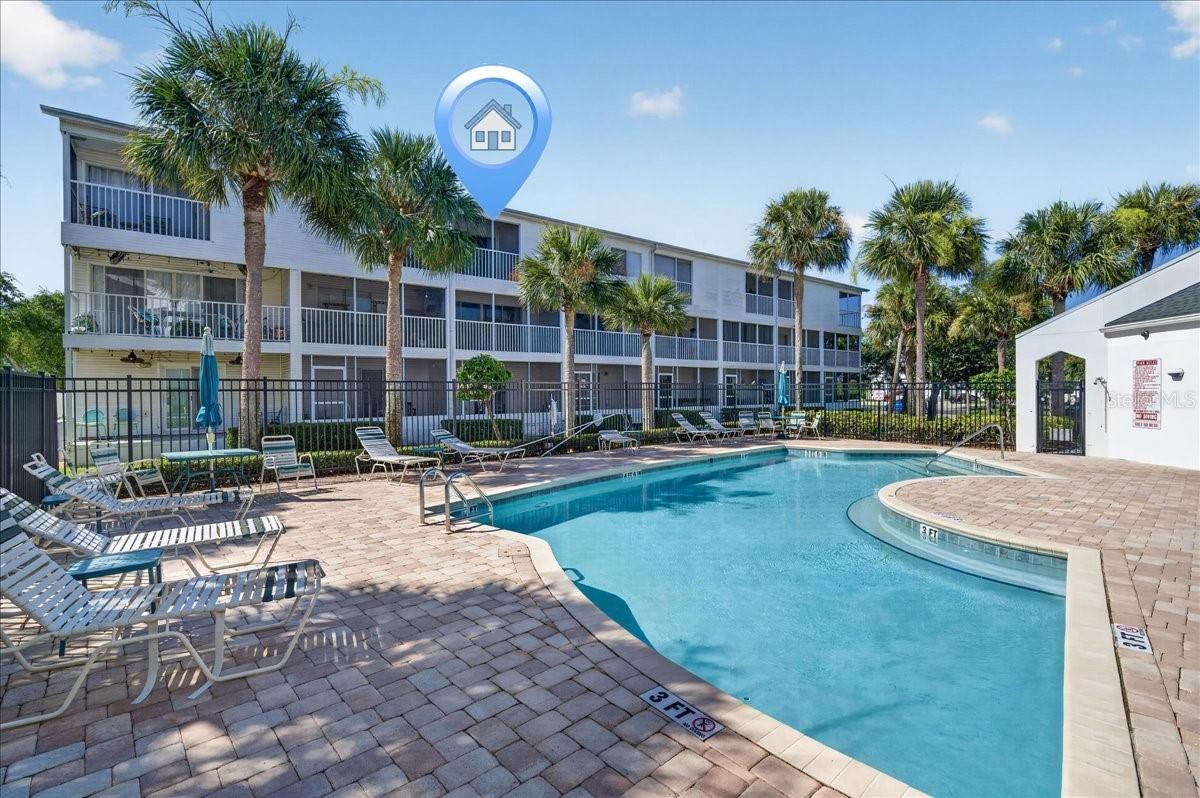 Come live the Coastal Florida dream in Tara Cay, a quiet waterfront community minutes from the beach. 
This townhome offers over 2,200 square feet of living space with 3 bedrooms and 3 full baths.
The ground floor includes a one-car garage with an automatic garage door opener, 
and a flexible living space can serve as a 4th bedroom, game room, office, or in-law suite.
Sliding glass doors lead to a screened patio overlooking the pool.
Upstairs on the second floor, the main living area boasts an expansive living and dining room combination with plenty of natural light and views of the pool. 
The kitchen's open-concept overlooks the dining room and living room.

A full bathroom and a spacious bedroom are also located on this level. Step outside onto the screened rear patio and enjoy the peaceful scenery and fresh breeze. 
The top floor has two master suites; one with an extra alcove for office, reading, crafts, etc. 
The master bedroom offers vaulted ceilings that make the room feel airy and open, a bathroom w/ walk in shower, 2 walk-in closets, & sliders leading to a private screened balcony.
 The third bedroom also includes its own private bathroom, perfect for guests or family members. 
For added convenience, the indoor laundry area is located on this floor as well. 

The natural light stands out, with windows and sliders throughout the home bringing in a bright, open feel that makes the space feel even larger and more inviting. 
The layout gives you flexibility for full-time living, guests, multigenerational needs, or a work-from-home setup. 

You are a short walk from the heated community pool, as well as a series of docks that are ideal for fishing, kayaking, paddleboarding, or pulling your boat up for short visits (Boaters may utilize the community docks for short-term docking for 48 hours – check with Property Management for the rules about utilizing the docks).
Beach goers are a bike ride from Indian Rocks Beach and a short drive to the Pinellas Trail parking area. Whether you want easy access to enjoy the great outdoors or room to unwind, entertain, or simply enjoy the Florida weather, this setup delivers.
Oversized garage offers plenty of room for storage, workbenches, and even a motorcycle. 
Located close to top-rated schools, excellent restaurants, and great shopping.

The HOA covers water, sewer, trash, cable, and high-speed internet, community dock, along with maintenance of the beautiful mature landscaping, boat docks, and access to the year-round heated pool. 
Pet-friendly neighborhood with NO weight restriction. Tara Cay is a pet and family-friendly community of 132 homes nestled in a park-like setting w/ lots of green space for walking. Schedule your private showing today.