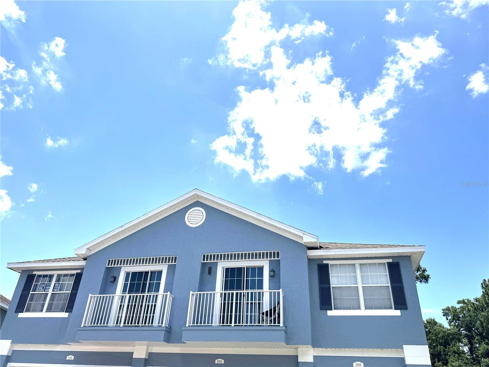 Stunning updated second-floor townhouse located in the highly desirable, gated community of Little Creek in the Trinity/New Port Richey area. Boasting 2 bedrooms, 2 bathrooms, and a split-floorplan design. Step inside to an expansive, sun-drenched open floor plan highlighted by dramatic vaulted ceilings, two sets of sliders opening to small balconies, and LVP flooring throughout the entire home. The bright kitchen is equipped with newer stainless steel appliances, a generous pantry closet, and a built-in desk area. Retreat to the spacious primary suite, complete with a private en-suite bathroom featuring a double vanity, a dedicated water closet, and a deep soaking tub. The secondary bedroom is on the other side of the unit and is adjacent to a full bathroom and steps from the dedicated laundry room for maximum convenience. This unit also features an attached one-car garage and access to a sparkling community pool. Walk to Deer Park Elementary School, shopping, and restaurants. Don't miss out on this pristine gem—schedule your tour today!