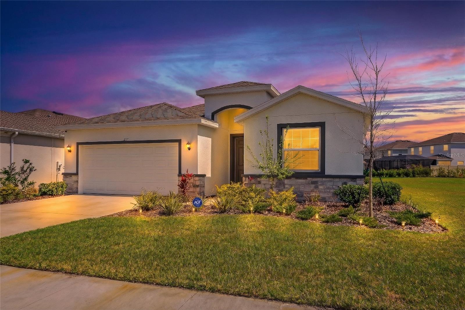 Why wait to build when you can move right into this beautifully upgraded 2024 home in the sought-after Coddington community? Situated on a spacious corner lot with a peaceful pond view, this 4-bedroom, 2.5-bath home offers over 2,000 sq ft of modern living with extra space, privacy, and everyday convenience.

Inside, the open and light-filled floor plan is designed for comfortable living and entertaining. The stylish kitchen features solid wood cabinetry, stone countertops, and a full appliance package including washer and dryer—plus an additional refrigerator in the garage.

Thoughtful upgrades set this home apart, including brand-new epoxy garage flooring completed just three months ago and durable, scratch-resistant, waterproof hardwood plank flooring in every bedroom. Step outside to the covered, screened-in lanai, perfect for relaxing Florida evenings.

The home also includes valuable smart and safety features such as a smart home control tablet, window and door sensors, an exterior security camera, and additional fire alarms that may help reduce insurance costs.

Located in a growing Bradenton community with convenient access to nearby schools, shopping, and community amenities including a pool, clubhouse, and playground. For buyers looking for a turnkey opportunity, the seller may also consider selling the home fully furnished.
