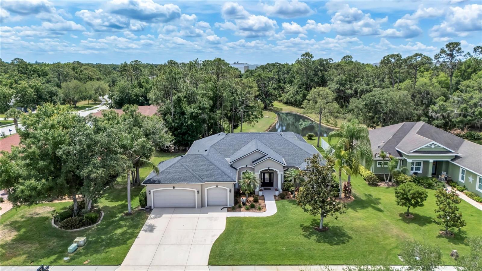 From the moment you step through the front door, your eyes are drawn straight to the long lake views—setting the tone for everything this home has to offer. This meticulously maintained 3-bedroom, 3-bath pool home with a dedicated home office/den blends comfort, functionality, and a truly beautiful setting.

Inside, you’ll find a well-designed layout with a private guest suite featuring its own en-suite bath—perfect for hosting family or friends. The additional bedroom and full bath provide comfortable space for guests, while the separate office/den offers flexibility for working from home, hobbies, or a quiet retreat. The home has been lovingly cared for, including a new roof installed in 2021, offering peace of mind to the next owner.
Step outside to an inviting pool and patio area made for Florida living—whether you’re enjoying quiet mornings overlooking the water or entertaining in the evening.
Situated on nearly half an acre, the property offers plenty of room to spread out, along with an oversized 3-car garage for all your storage needs.
With low HOA fees and no CDD, and A rated school district this home delivers both value and lifestyle in one exceptional package
