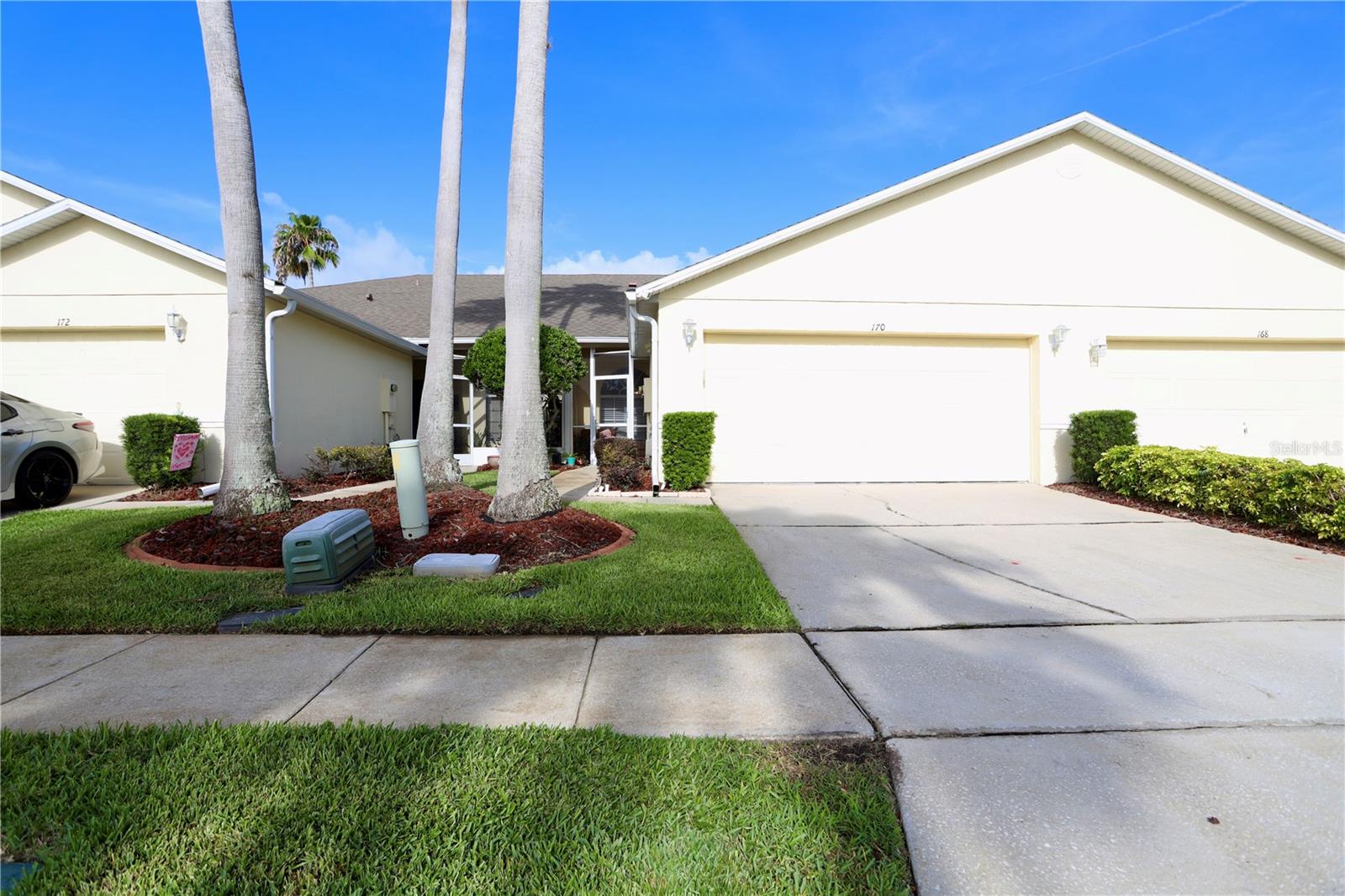 170 Club Villas is officially on the market and ready to welcome its new owners! This beautifully maintained 2-bedroom, 2-bathroom townhome with a den/office is perfectly positioned along the spectacular, serene, and challenging golf course at Remington Golf Club, offering picturesque views of the fairway, sand trap, and a sparkling pond. With over 1,400 square feet of heated living space, this townhome has everything you've been looking for, including a spacious open floor plan, a 2-car garage, a screened rear porch, and access to an amenity-rich community designed for an active Florida lifestyle. Start your mornings on the covered, screened front porch with a cup of coffee, or end the day relaxing with a glass of wine while enjoying the peaceful surroundings. Inside, you're welcomed by a bright dinette and a spacious kitchen featuring stainless steel appliances, stunning black countertops, and a breakfast bar that overlooks the open living and dining areas. Abundant natural light, expansive tile flooring, and generous living space create a warm and inviting atmosphere throughout. The spacious primary suite is a true retreat, complete with a charming bay window overlooking the golf course and a private en-suite bathroom with a walk-in shower. The second bedroom and bathroom provide comfortable accommodations for guests or a home office. Life at Remington means more than just a beautiful home. Residents enjoy gated security, scenic walking paths, a community pool, tennis and basketball courts, a clubhouse, a playground, and so much more. Conveniently located just 3.5 miles from the Florida Turnpike, 3.8 miles from the St. Cloud Lakefront, where you'll find four miles of waterfront walking paths, a splash pad, marina, boat ramp, fishing pier, park, and waterfront dining, and only 4.5 miles from Downtown St. Cloud with its local restaurants, boutique shopping, and movie theater, this location truly has it all. Whether you're searching for your primary residence, a seasonal getaway, or your next investment, this exceptional townhome checks every box. Schedule your private showing today and come experience everything this beauty has to offer!