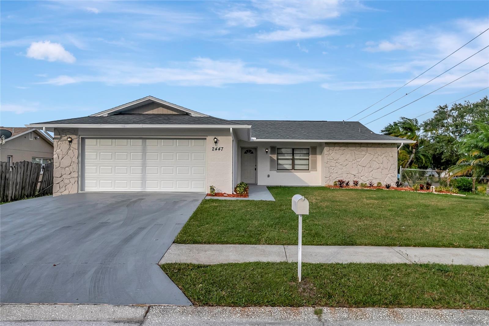 TASTEFULLY UPDATED DREAM HOME!  A true 3 bedroom 2 bath.  Beautiful corner lot on nearly a 1/4 acre.  Nestled in the back of this established neighborhood on a Cul De Sac.  NO HOA OR DEED RESTRICTIONS!   Open floor plan, many NEW updates!  NEW ROOF AND AC IN 2023!!!  Fresh Paint inside and out!! Beautiful water resistant life lock laminate flooring throughout the common areas, and new carpet in the bedrooms. The cook in your house will appreciate the brand new kitchen featuring all wood cabinets and custom countertops as well as Brand New appliance package. Bathrooms have all been fully updated with new vanities, updated lighting and plumbing fixtures. The open floor plan makes this home great for entertaining. Great curb appeal and beautiful interior make this home move in ready! Low Taxes and No HOA make this an affordable option!