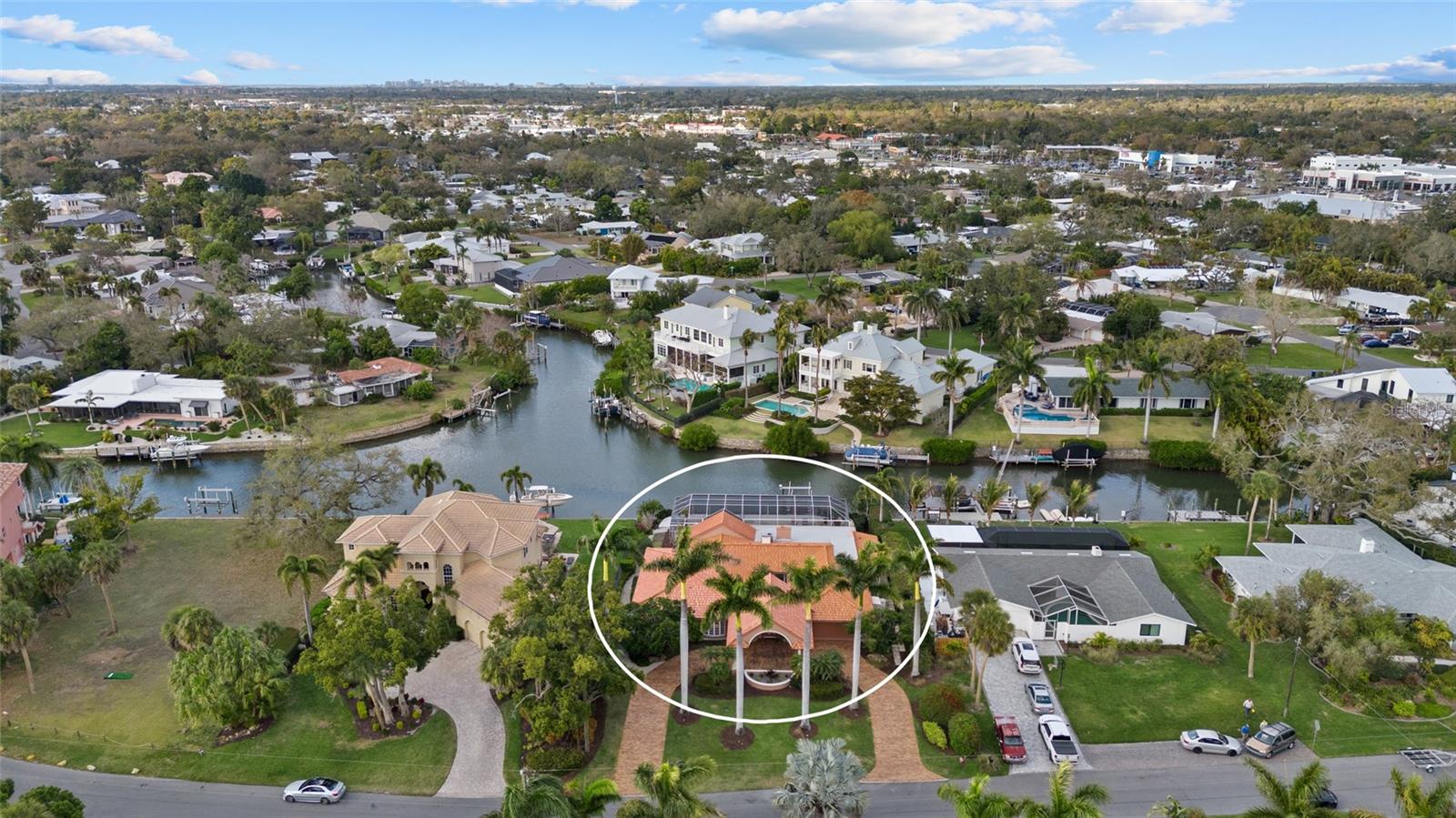Tucked in the waterfront enclave of Southpointe Shores, 1749 Sandalwood Drive is a refined expression of coastal elegance and modern sophistication in a rare private compound estate in one of Sarasota’s exclusive and premier waterfront communities. Positioned just moments from the world-renowned beaches of Siesta Key, this exceptional, furnished residence offers a lifestyle defined by tranquility, beauty and effortless access to the best of Sarasota. Set beneath a canopy of mature palms and lush tropical landscaping, the home welcomes you with understated architectural grace and a sense of privacy that feels exclusive and serene. The heart of the home was thoughtfully redesigned with a complete kitchen, dining, bar and living transformation featuring Lube of Italy imported custom cabinetry, Thermador appliances including a warming drawer, Brazilian granite with semi-precious stone detailing, Italian marble flooring, and curated lighting throughout. Impact glass windows and doors enhance safety and natural light, with integrated indoor/outdoor Sonos audio, a whole-house security system with 12 cameras (2024), and dedicated electronics infrastructure providing seamless technology integration. Expansive living and entertaining areas flow seamlessly to an impressive lanai with pool and spa, creating an ideal setting for indoor-outdoor entertaining. Whether hosting sunset gatherings, enjoying a quiet morning coffee with coastal breezes, or relaxing poolside beneath the Florida sky, the home is designed to celebrate everyday living and special occasions. This home is two homes from the intercoastal. For boating enthusiasts, deepwater access provides a gateway to Sarasota Bay and beyond. A 12,000-pound boat lift and 50-amp dock service ensure convenience and capability, supporting a waterfront lifestyle, within minutes of open water and two houses from the intercoastal. Southpointe Shores is treasured for its wide canals, boating culture and established residential character. Residents enjoy proximity to premier marinas, fine dining, boutique shopping, and Sarasota’s vibrant arts and cultural scene. Siesta Key Beach, consistently ranked among the finest in the world, is just a short drive away, offering powder-soft quartz sand and breathtaking Gulf sunsets. Major updates include a new roof (2018), room addition (2018), full re-pipe (2021), pool equipment replacement (2023) and new air-conditioning systems (2024), reflecting the care and investment made throughout the years. A rare opportunity to embrace refined waterfront living in one of Sarasota’s desirable neighborhoods, where every day feels like a retreat and every evening captures the essence of coastal Florida.