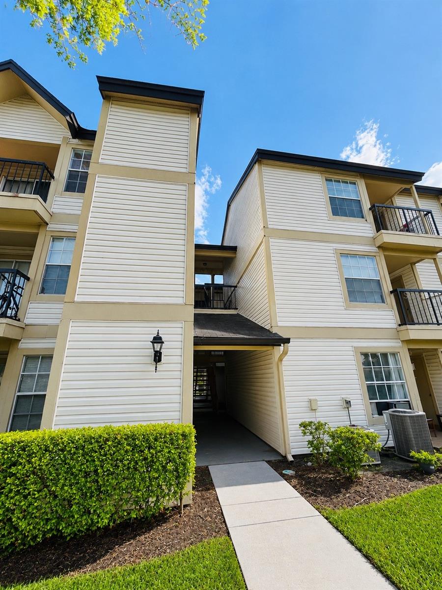 Welcome to Millennium Plaza Condominium, a charming 1-bedroom, 1-bathroom condo located on the third floor of the gated Plaza at Millennium community near The Mall at Millenia. Conveniently situated near S. John Young Parkway and Americana Boulevard, this property offers easy access to shopping, dining, I-4, parks, lakes, and major Orlando attractions. Inside, you’ll find a spacious open floor plan featuring hardwood floors, vaulted ceilings, a ceiling fan, a large living and dining area, and a fully equipped kitchen with an adjoining pantry/laundry room. The bright and spacious bedroom offers direct access to a private balcony overlooking the community, while the bathroom features a tub and shower combination. Additional highlights include exterior storage space and abundant natural light throughout. Residents enjoy access to resort-style amenities including a swimming pool, clubhouse, fitness center, and laundry facilities, making this an excellent opportunity for homeowners and investors alike.