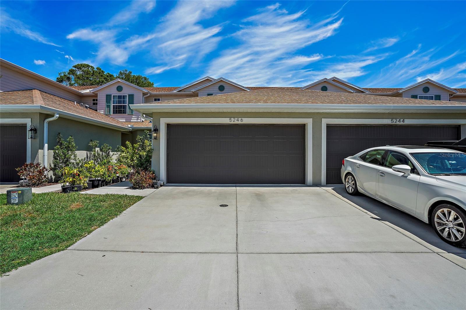 Flood Zone X, 2021-built, with a first floor primary suite: a combination almost nothing under $450k in Pinellas County offers. This townhome is centrally located in St. Pete, and the roof, AC, and water heater are all just under five years old.
Inside: 3 bedrooms, 2.5 baths, 1,713 sq ft. The first-floor primary suite has dual closets, a large en suite bath, and sliders to a screened patio backing to green space. The main level is an open kitchen with quartz counters and Whirlpool appliances, plus dining and living in one connected space. Upstairs holds two more bedrooms, a full bath, and a 12x13 loft that works as an office, playroom, or second living room. The gated community welcomes big dogs, most breeds, up to 101+ lbs. And because it's a townhome, not a condo, there are no milestone inspections and no structural reserve studies needed. The $550/month HOA covers water, sewer, trash, pool, and clubhouse.

The location is the quiet superpower: centrally located in Pinellas County, 2 minutes from I-275, you can get anywhere from here. Tampa in 15, Downtown St. Pete in 10, St. Pete Beach in 15, and the airports, the Gulf beaches, and north county are all an easy shot. Five years old, in the dry zone.