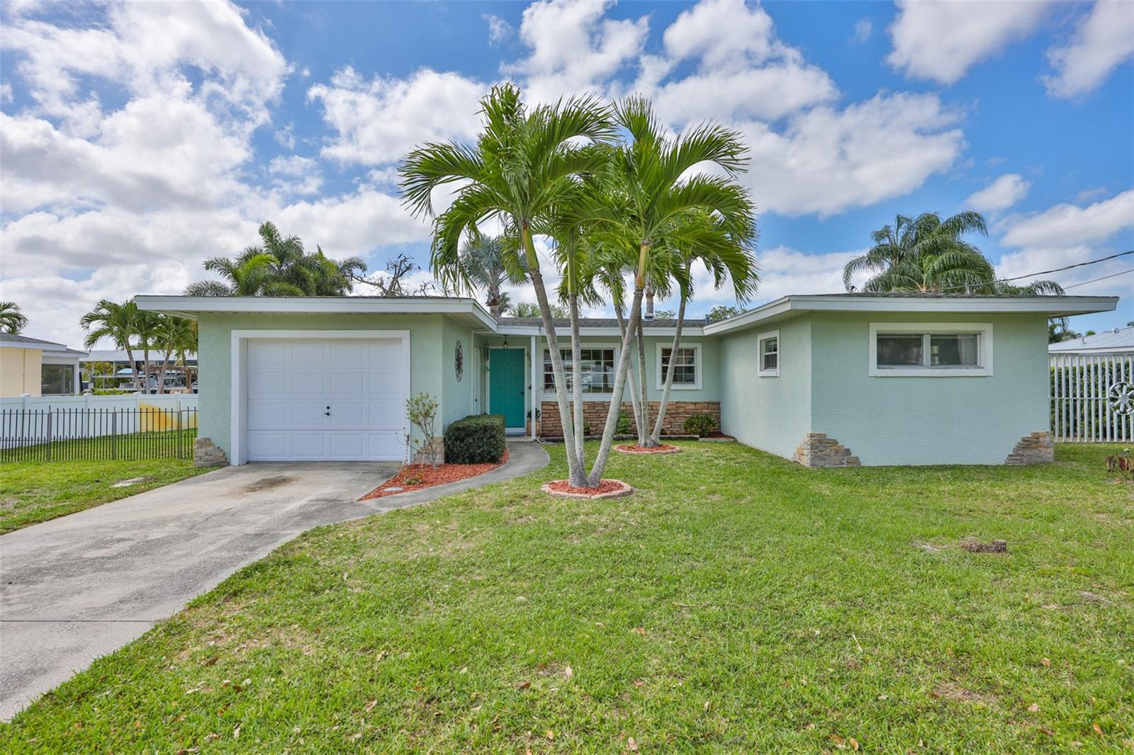 This NW Bradenton waterfront home on Warner West Bayou with quick and easy access to Manatee River, intercoastal waterways, Tampa Bay and the gulf offers boaters and fishing fanatics a great opportunity.   Charming and cozy, the 2bedroom/2bath could be perfect for seasonal snowbirds or locals that do not want to waste time at boat ramps.  Avoid the traffic and congestion on the island.  No HOA or deed restrictions.  Newer appliances and electrical panel.  Screened back patio overlooking the water and a large outdoor entertaining space surrounded by a fenced back yard.  Work shed/carport with plenty of additional storage sits next to a covered (24' x 21') boathouse with (10,000 lb) boat lift.  Wrap around dock access makes cleaning up after another amazing day on the water convenient.  Dock has water and electricity.  Less than 5 miles to downtown Bradenton/Riverwalk and less that 6 miles to Anna Maria Island beaches.  Robinson Preserve, Desoto National Park, Palma Sola Botanical Park and shopping/dining nearby.  Great value for a location that could not be better.