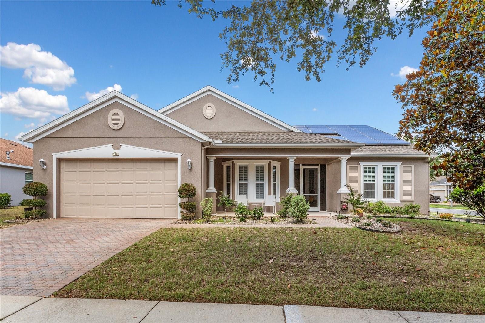 Live the Florida lifestyle in this beautifully upgraded home in the highly sought-after resort-style community of Trilogy.  The home is well-maintained with valuable recent upgrades, including a new roof, a 2025 water heater, solar for added energy efficiency, new water softener and a new controlled sprinkler system.
Perfectly positioned on an oversized corner lot, this impressive residence offers standout curb appeal with a screened front porch, designer front door with sidelight, all welcoming you into a light-filled open floor plan designed for both comfort and entertaining.
Inside, you will discover 2 bedrooms, 2 baths, and a versatile den, including a private en suite bath for the second bedroom—ideal for guests. There is a mosaic custom tiled inlay in the foyer, and no carpet, giving the home a clean, stylish feel throughout. The updated kitchen features a gas stove, custom pantry, cabinetry with under-cabinet lighting, and newer appliances, while custom arches add distinctive architectural character. Every detail has been thoughtfully maintained, including twice-yearly A/C service, a termite bond, and numerous functional upgrades that make everyday living effortless.
The oversized primary bedroom is a true retreat, complete with custom remote blackout shades, a massive built-in closet, and a custom doorway leading directly to the laundry room. An enclosed lanai with split A/C unit extend your living space beautifully for year-round enjoyment while an outdoor kitchen rounds out entertaining space. The smart space can easily function as a laundry room, office, or hobby room. The garage is equally impressive with shark coating flooring, storage cabinets, and a new opener. Even the furnishings have flexibility—furniture and the piano are negotiable—making this exceptional Trilogy home an outstanding opportunity.
Trilogy Cascades of Groveland is a guard gated community centered around the 57,000 sq. ft. Magnolia House and focuses on exercise and entertainment. A full-service restaurant and bar, two gyms, indoor and outdoor pools, spas, a walking trail, dog park, tennis, pickle and bocce ball await you.  50+ clubs, concerts, shows, demonstration kitchen, massage room, dance studio, poker lounge, golf simulator, billiards and more add to living your desired lifestyle.  
The HOA monthly fees include lawn/shrub maintenance, basic cable, internet with landline, home security monitoring, streetlights, street maintenance, guard gated front entrance and clubhouse amenities.
The community allows residents between the ages of 45 to 54 with HOA approval.  
This home is a rare find, blending luxury and practicality while living in a vibrant community. 
You may be sorry if you miss out on this one-of-a-kind home.  Call now for your private showing.