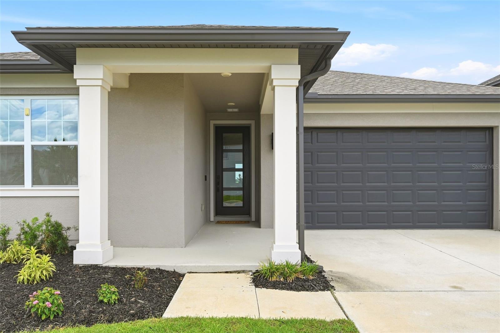 ONE OF A KIND in popular Villages Hills of Minneola  -  This beautiful home is on an oversize lot with VIEWS! VIEWS ! STEP INSIDE AND Be Ready to enjoy all the best of living life in a well-appointed home with upscale finishes. From the Front Entry Door with attractive glass panes to floors with Stone Polymer flooring which provides high level of beauty and impact resistness. Ten ft ceilings and doors, Double Custom French Doors +  Tray ceiling present All of the comforts. The Kitchen includes Quartz Counters, huge ISLAND with Bar seating & oversize Stainless steel sink.  Samsung Stainless appliances: Refrigerator, Oversize 5 Burner Range Top and Oven, Dishwasher, and Microwave.  Walk-In Large Pantry too!  Split Bedroom Plan with Master Bedroom has VIEWS! - Huge Master Bathroom with quartz counters and double sinks. SPACIOUS WALK-IN CLOSET AND UPPER SHELVING  -Tub in HALL Bathroom -
    *** Charming Porch has PHANTOM ELECTRONIC SCREEN ***
 Energy Efficient Double-Paned Windows, Insulation in Attic -2 CAR GARAGE with Automatic Opener - FIBER OPTICS IN COMMUNITY
AND K-8 Public School - Grocery- Shopping - new Crooked Can - all within the immediate area + New Hospital and Lake Ridge Winery
   Don't Miss Out.