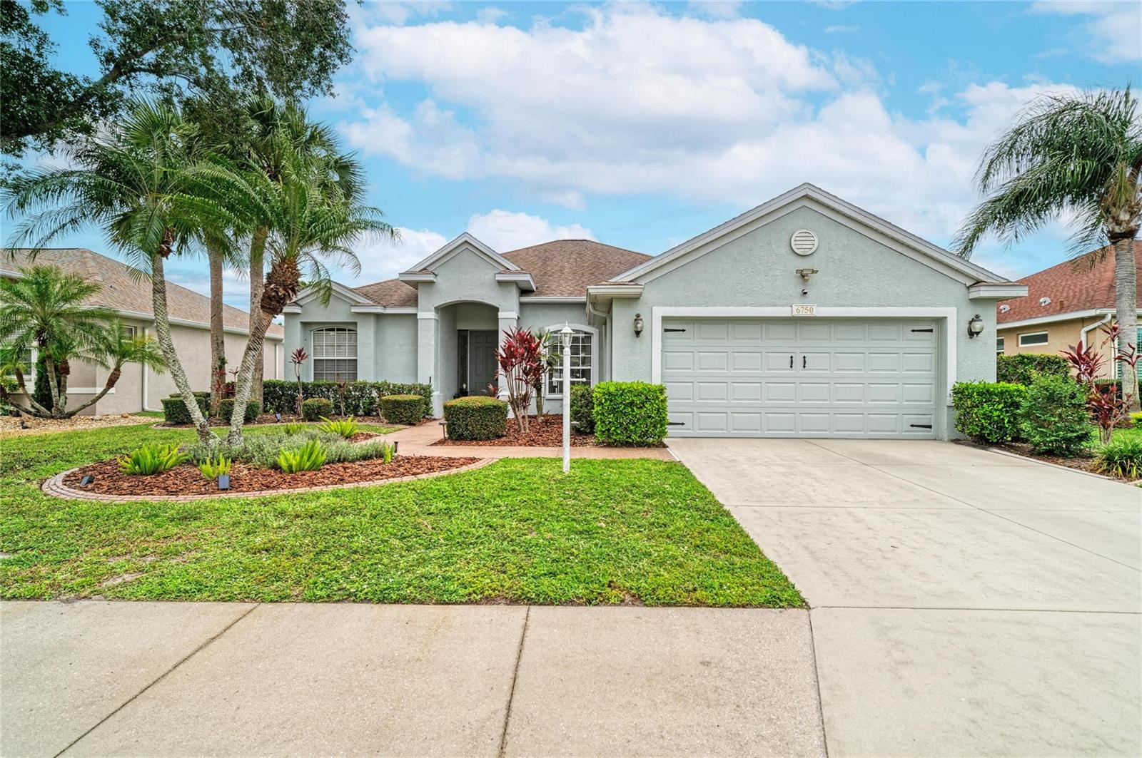 Recently renovated and thoughtfully upgraded, this exceptional pool home in the highly desirable Whisper Bend/Water Oak community offers a newer roof (2020), a Briggs & Stratton 20KW whole-house generator (2023), spectacular outdoor living spaces, and numerous high-value improvements, this move-in-ready residence is designed to impress. Offering 3 bedrooms, 2 bathrooms, and a versatile flex room with double glass doors, the layout easily accommodates a home office or potential 4th bedroom to suit your lifestyle. Upon entering, the stunning great room immediately captures attention with soaring vaulted ceilings, luxury vinyl plank flooring, a custom shiplap accent wall, built-in electric fireplace, and triple sliding glass doors that seamlessly connect indoor and outdoor living. The formal dining room is perfectly positioned at the front of the home and showcases a stylish chandelier, window treatments and abundant natural light. The chef-inspired kitchen is appointed with granite countertops, timeless subway tile backsplash, under-cabinet lighting, updated brushed nickel hardware, and premium Samsung and LG stainless steel appliances, including a natural gas range. A reverse osmosis water filtration system provides purified drinking water, while the breakfast nook overlooks the pool and the breakfast bar offers additional seating and the perfect space for entertaining. The spacious primary suite serves as a private retreat, featuring direct lanai access, newly added HVAC ductwork for enhanced comfort, and dual custom walk-in closets separated by a stylish bench and decorative mirror. The spa-inspired en-suite bath offers dual vanity areas, a relaxing garden soaking tub beneath a picturesque window, and a walk-in shower complete with both rainfall and spa-style showerheads. Additional interior enhancements include newer dimmer switches, beautifully renovated laundry room featuring extensive cabinetry, a built-in utility sink, and front-load washer and dryer on pedestals. The split-bedroom floor plan provides privacy for family and guests, with two guest bedrooms sharing an updated bathroom featuring quartz countertops and convenient door to your own private backyard oasis. The covered lanai overlooks a sparkling saltwater pool equipped with a newer chlorinator, LED lighting/pool pump/filter system, and solar heating. Beyond the pool, a fenced backyard offers a spacious paver patio and a custom putting green, perfect for practicing your short game. Additional valuable improvements include a transferable generator warranty, a Rinnai natural gas tankless water heater (2019), upgraded exterior lighting, and lush professional landscaping. Residents enjoy the added benefit of low HOA fees and NO CDD fees. Ideally located near Tara Elementary School and just minutes from Tara Preserve Golf Club's recently updated 18-hole championship golf course, this home also offers convenient access to the popular Linger Lodge and Jiggs Landing Outpost, where residents can enjoy waterfront dining, live music, kayaking, fishing, and a true Old Florida experience. With easy access to I-75, Lakewood Ranch, University Town Center, top-rated schools, shopping, dining, parks, and the Gulf Coast's world-renowned beaches, this location truly offers the best of Florida living. This exceptional home is available for immediate occupancy and presents a rare opportunity in one of the area's most convenient and established communities.