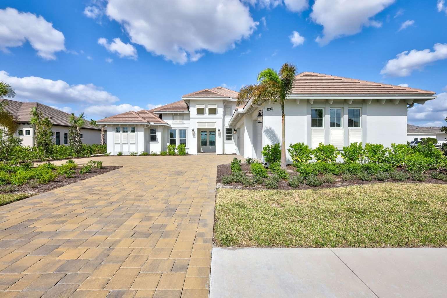 BRAND NEW EXECUTIVE SINGLE-FAMILY POOL HOME in Wild Blue at Waterside. This Covington III Stock Luxury Home features 3,138 sq ft with 3 bedrooms, 3 baths, a great room, dining area, study, bonus room, and spacious outdoor living, including a heated pool, spa, and 3-car garage. The large waterfront lanai is ideal for outdoor living and entertaining, with a gas fireplace and fully equipped outdoor kitchen with grill, sink, and beverage cooler. Ready for immediate occupancy. Wild Blue Clubhouse and Midway Sports Complex are planned community amenities. Excellent location near I-75, beaches, Nathan Benderson Park, UTC, and shopping, dining, and entertainment options.